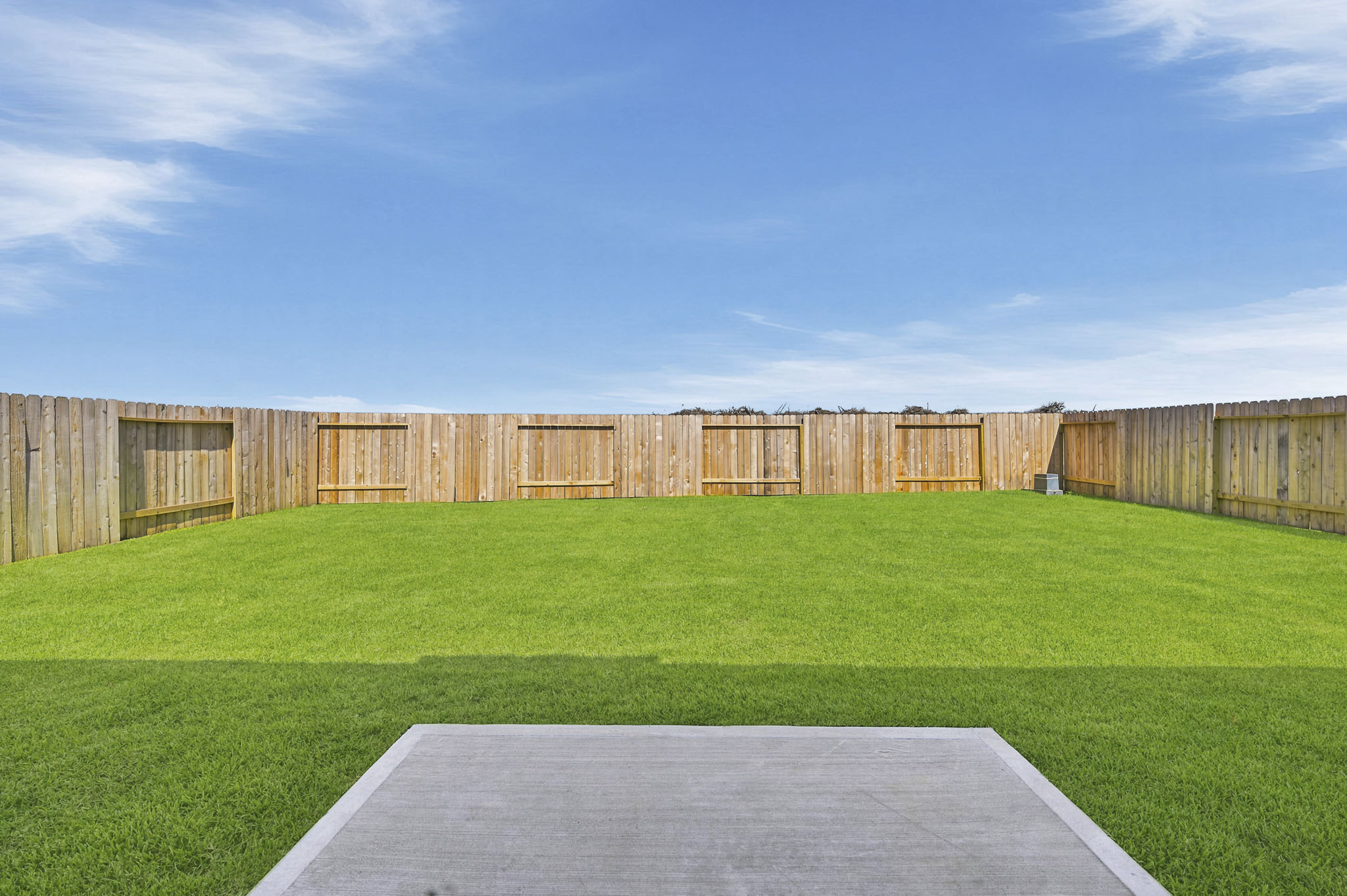 A large field with a fence around it.