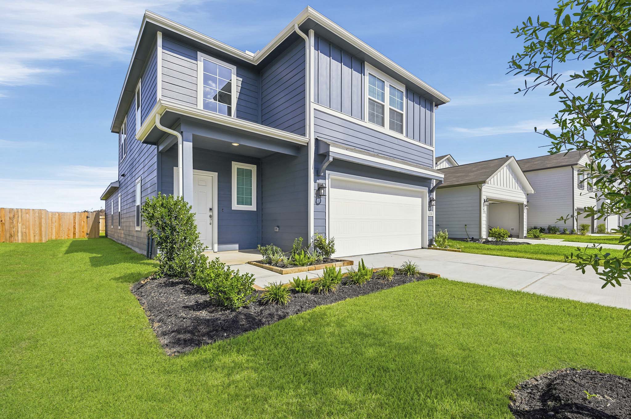 A house with a large front yard.