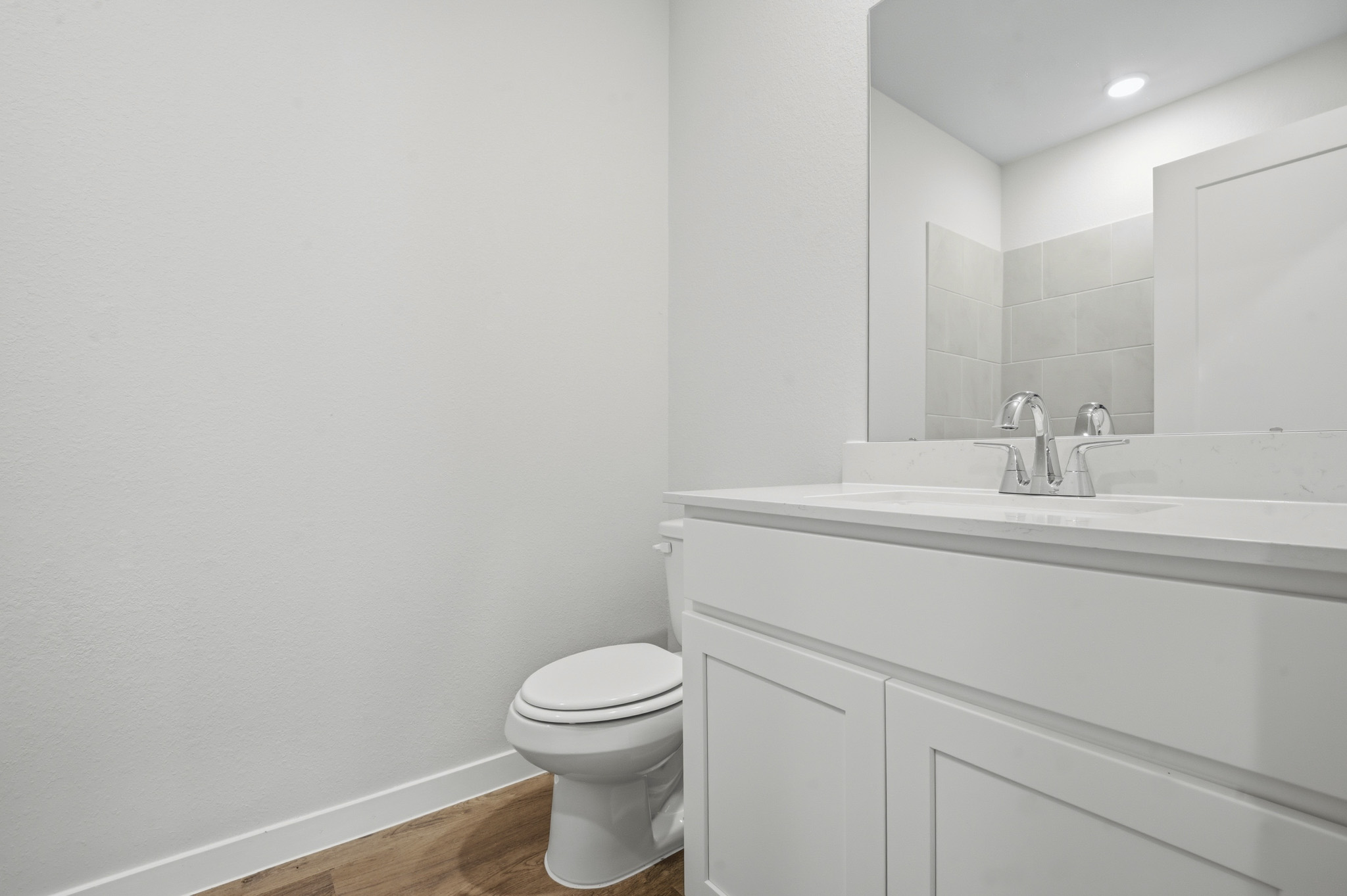 A bathroom with a toilet and sink.