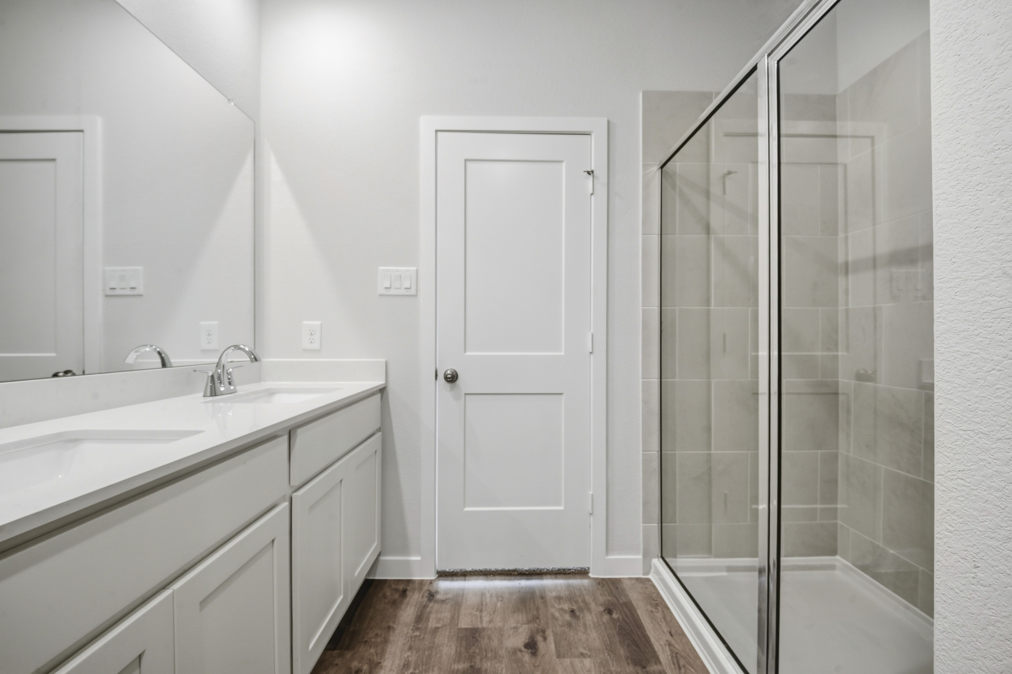 A bathroom with a glass shower.