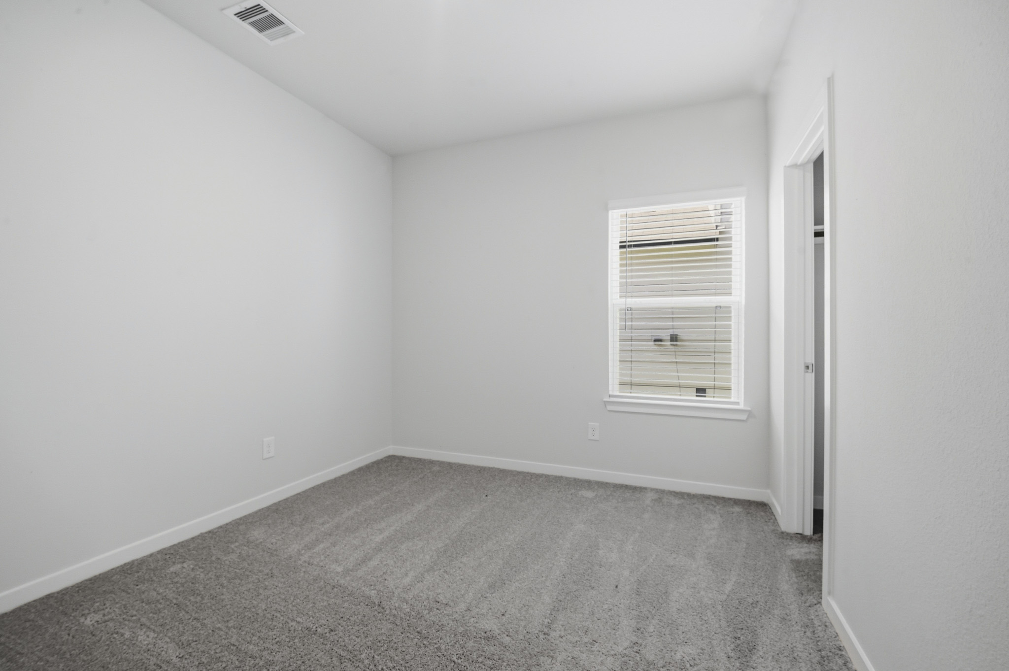 A room with a door and a window.