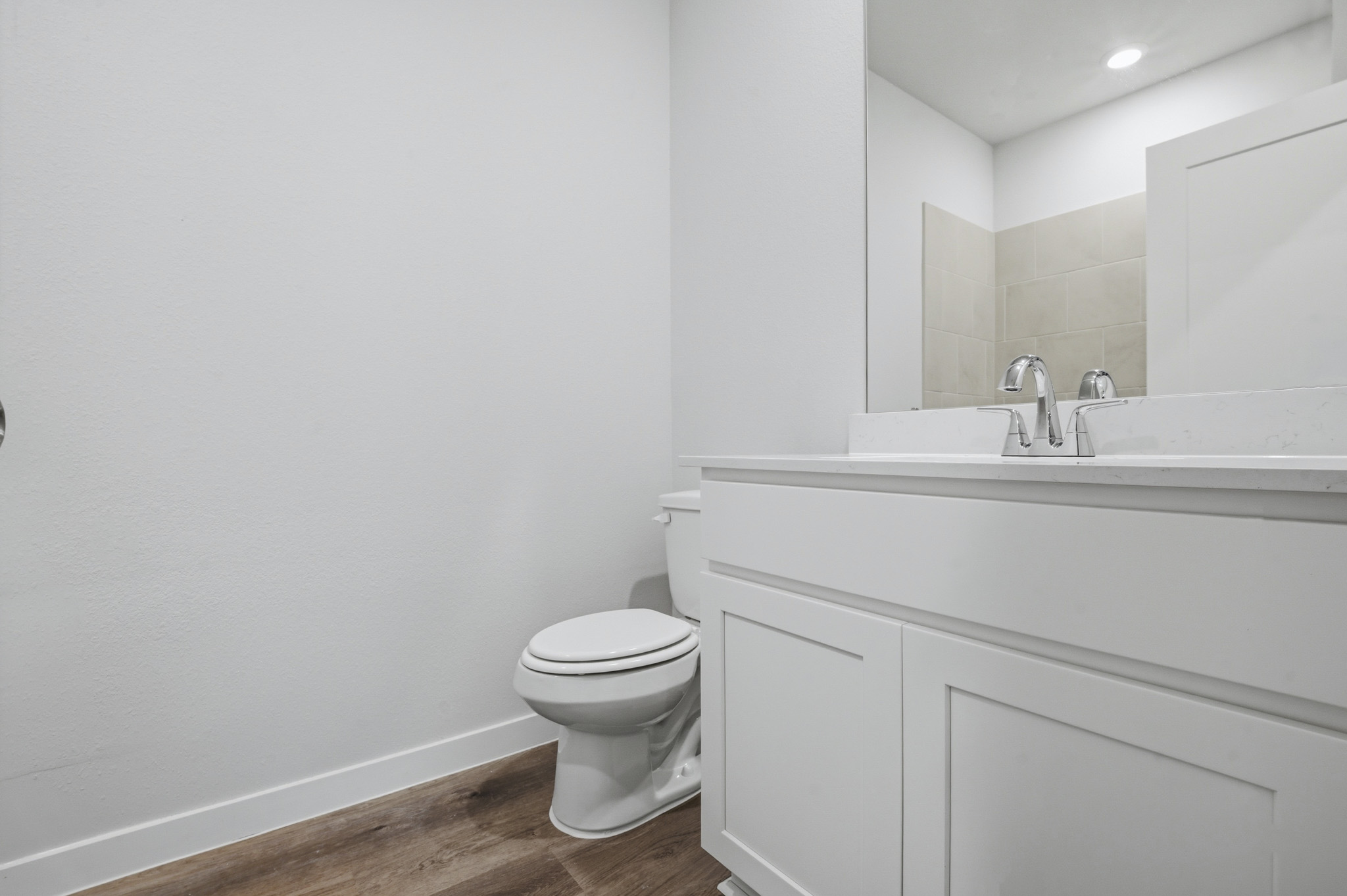 A bathroom with a toilet and sink.