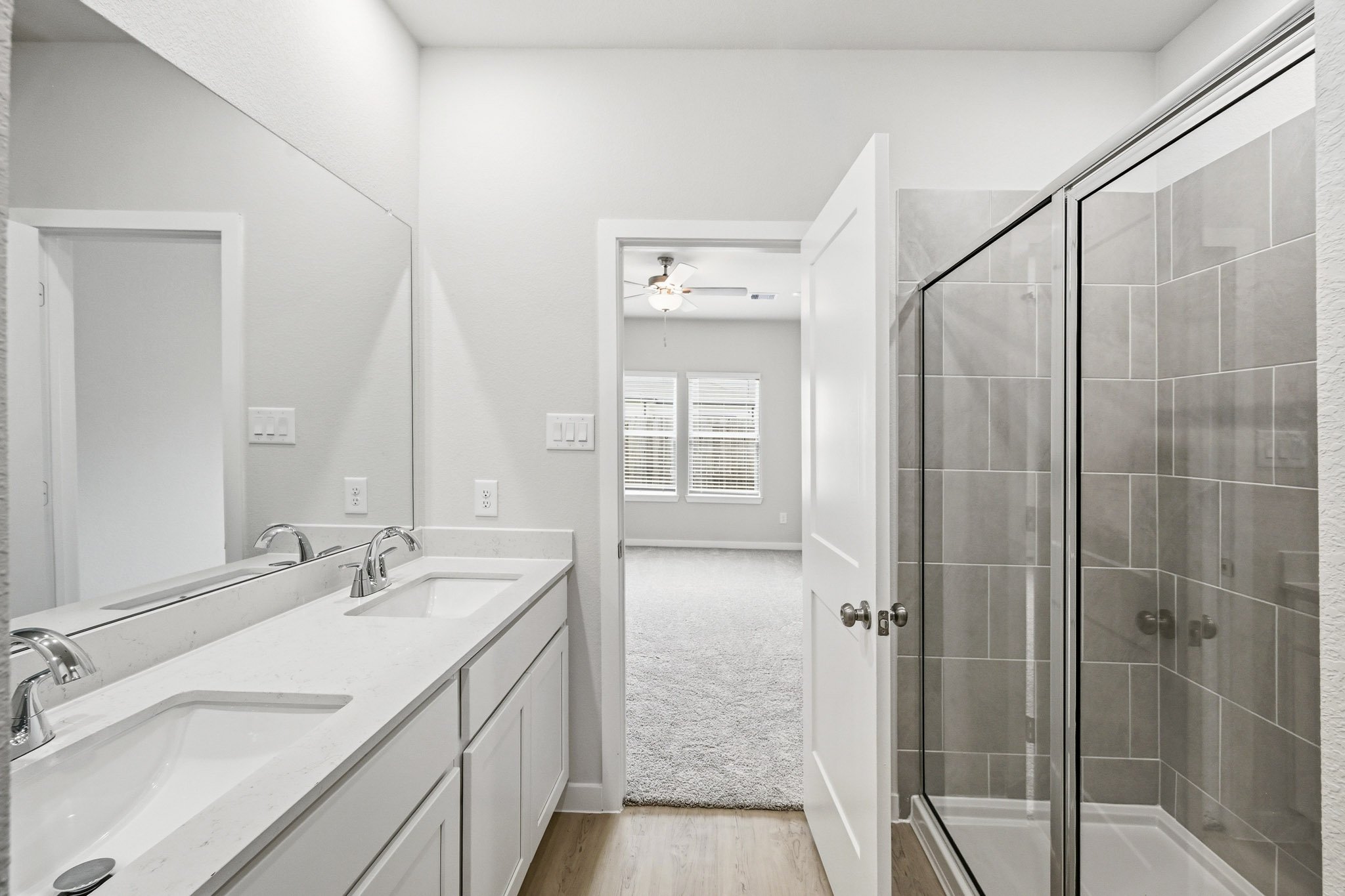 A bathroom with a glass shower.