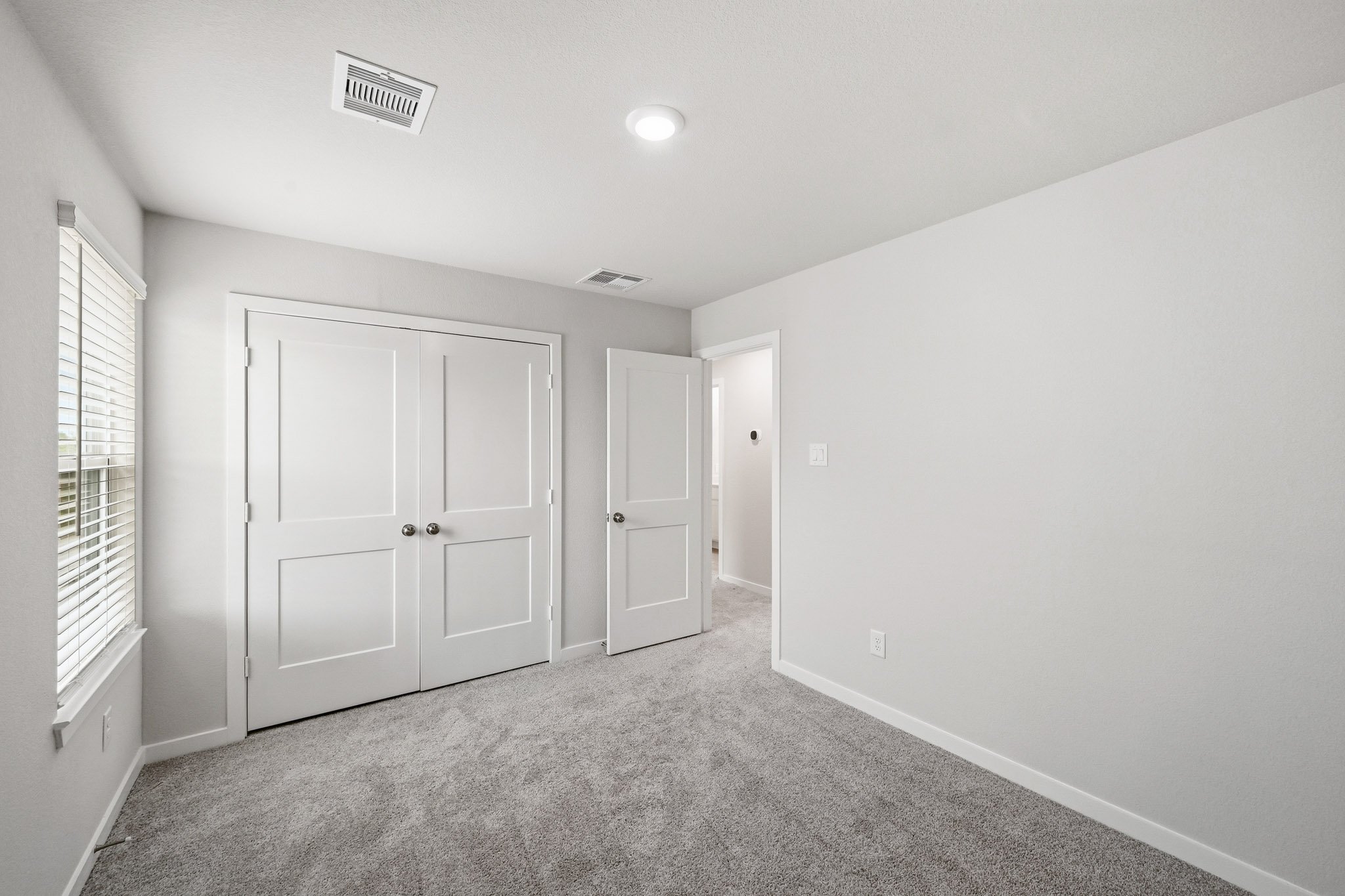 A room with white doors.