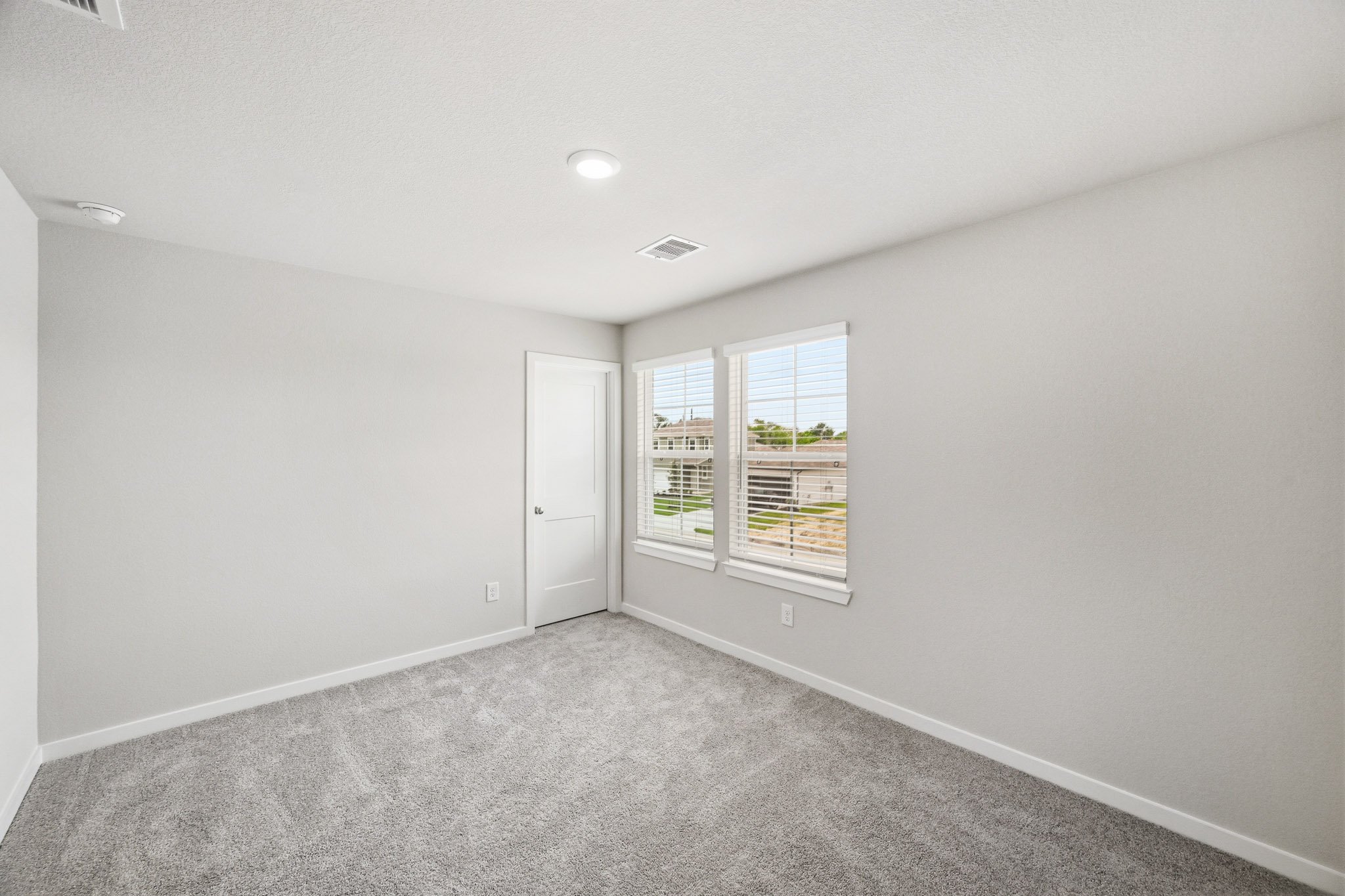 A room with a door and a window.