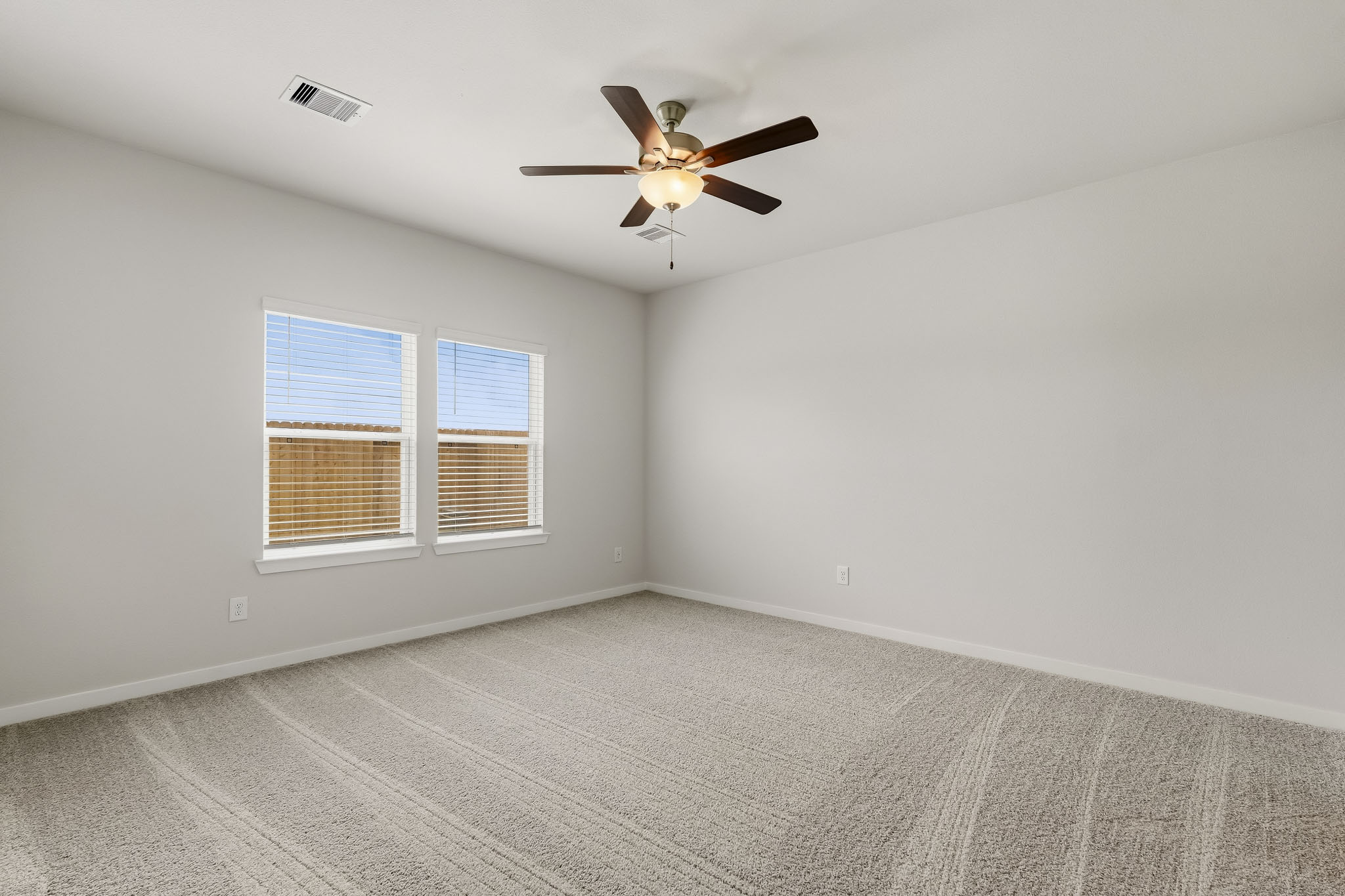 A ceiling fan in a room.