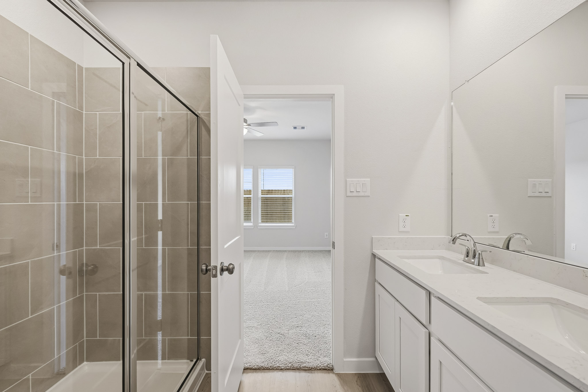 A bathroom with a glass shower.