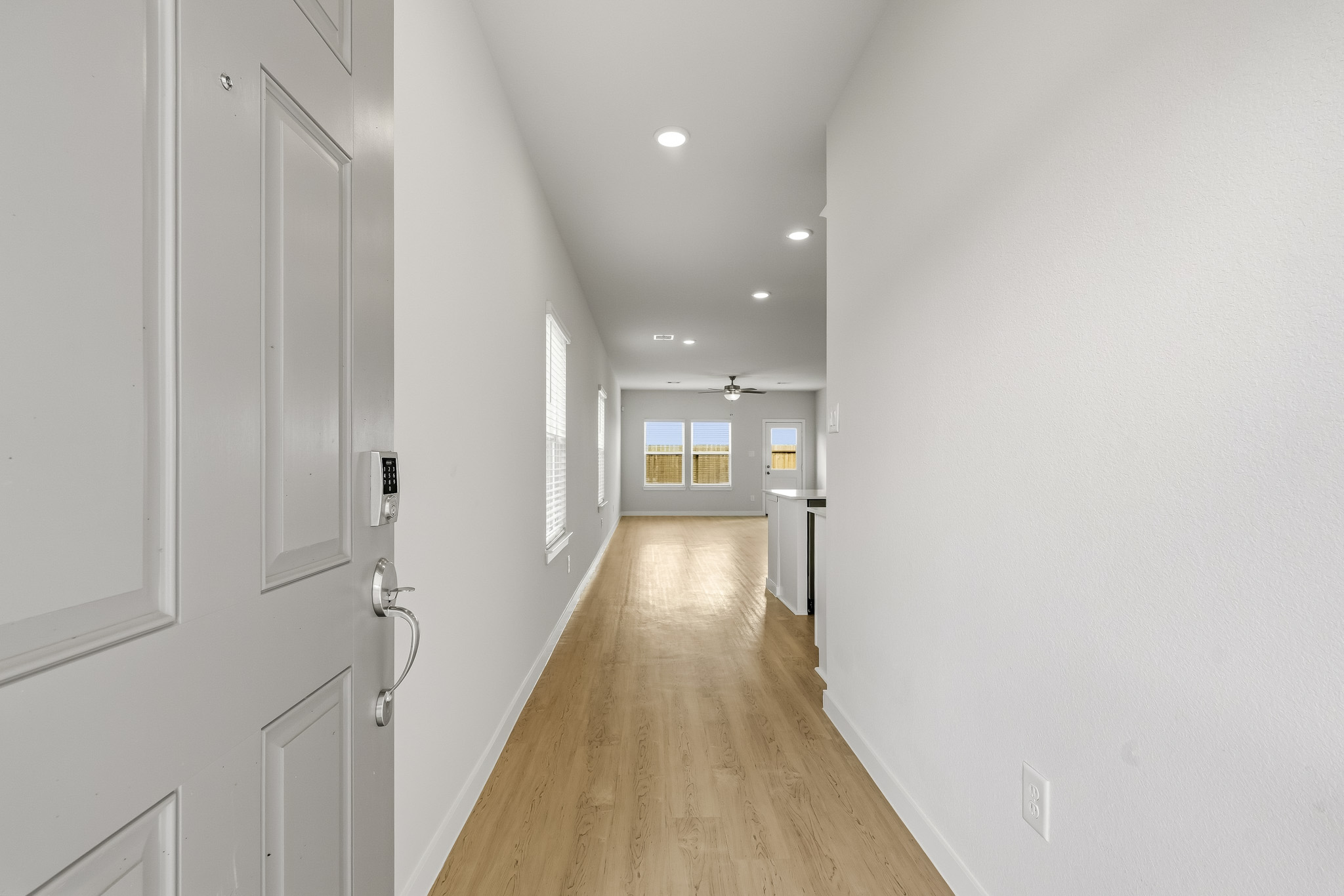 A hallway with white walls.