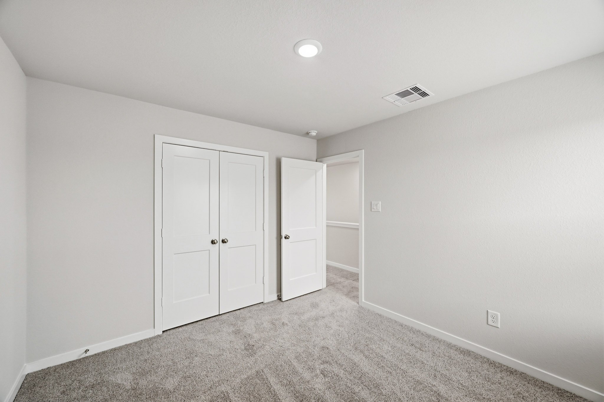 A room with white doors.