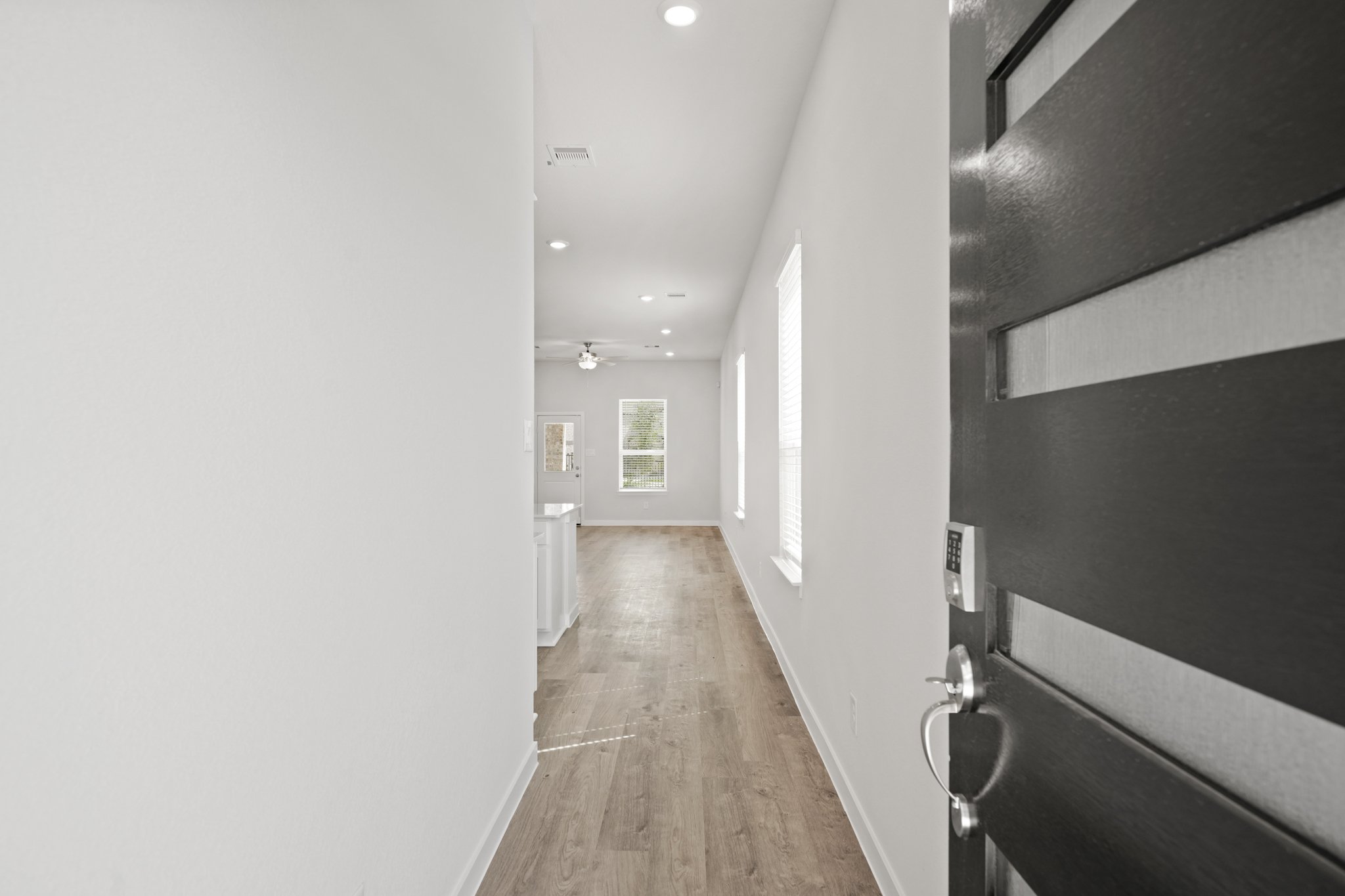 A hallway with white walls.