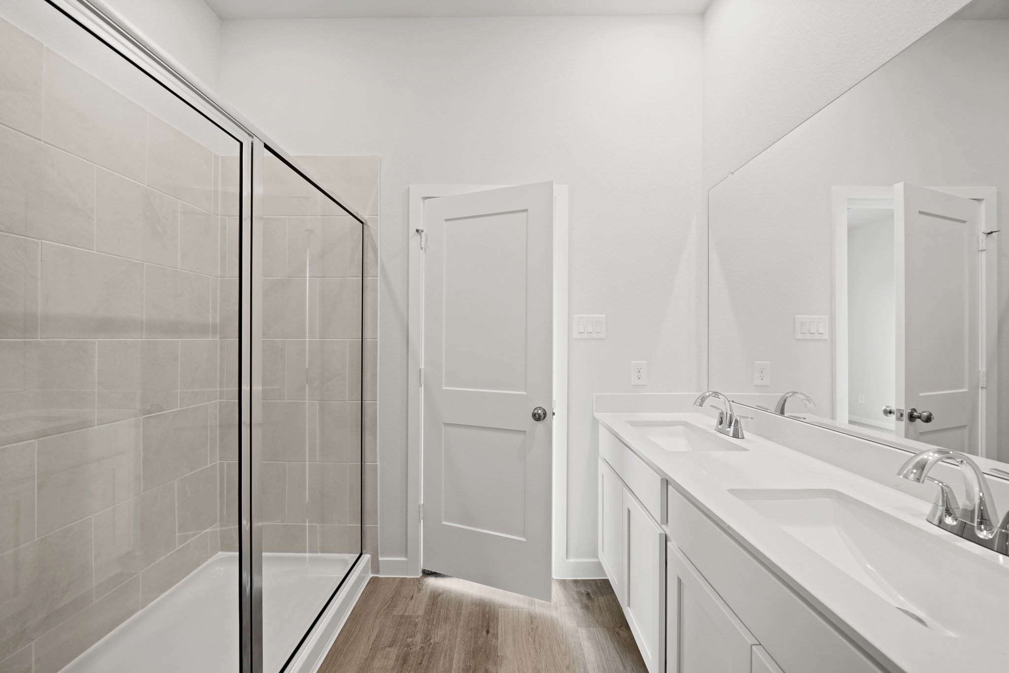 A bathroom with a glass shower.