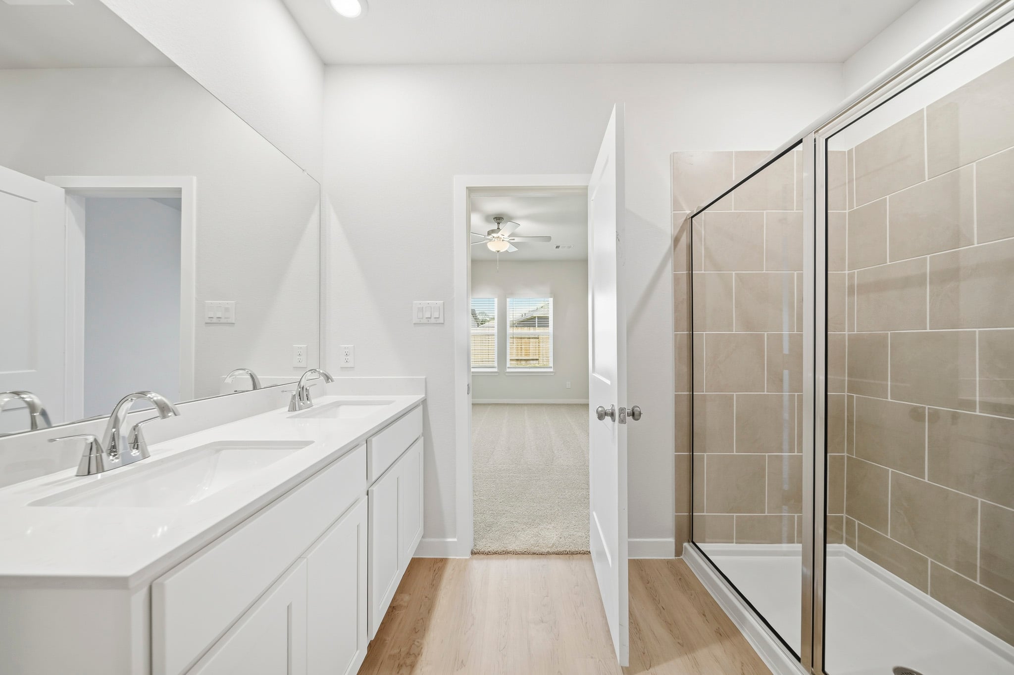 A bathroom with a glass shower.