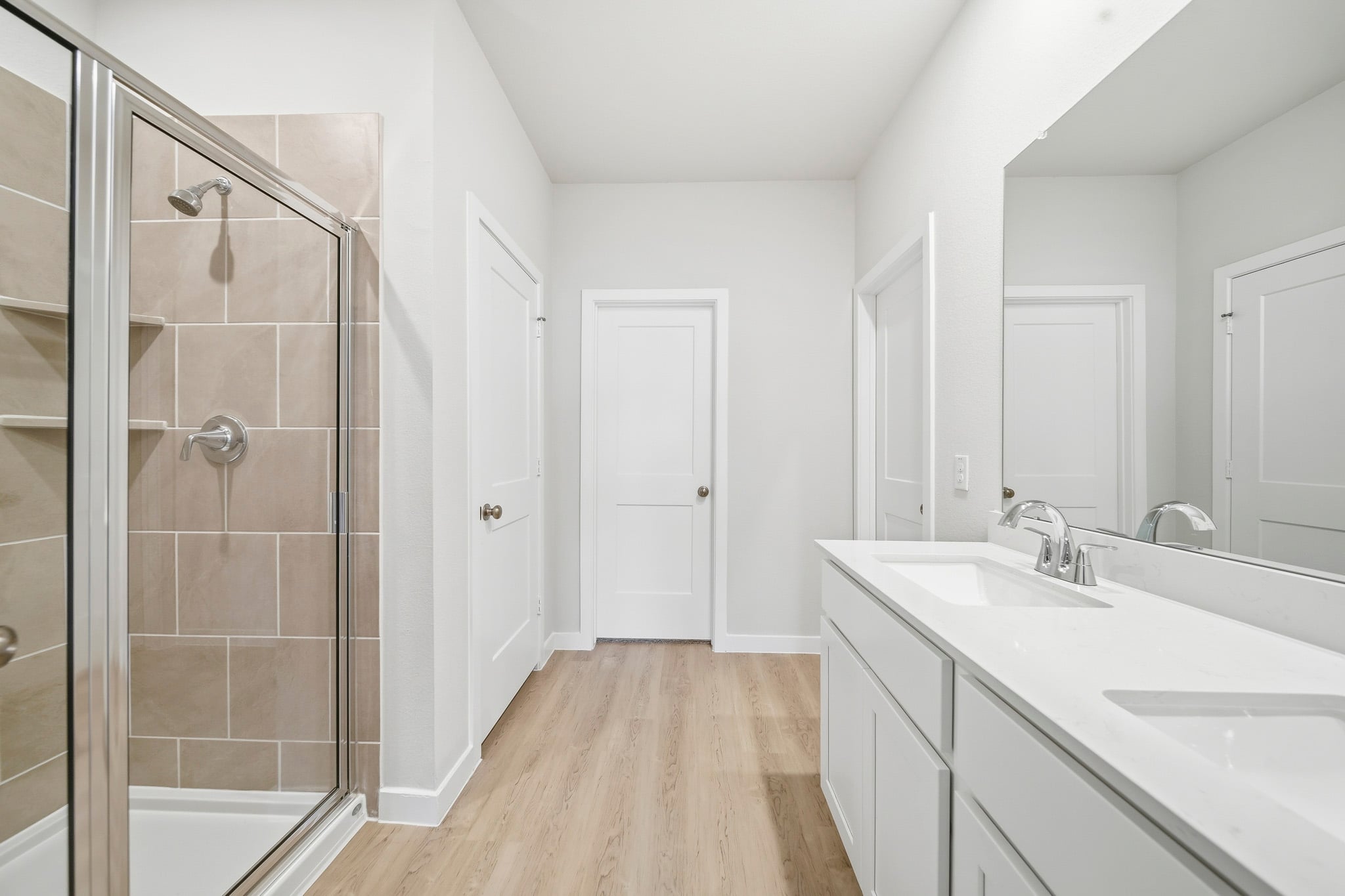 A bathroom with a glass shower.