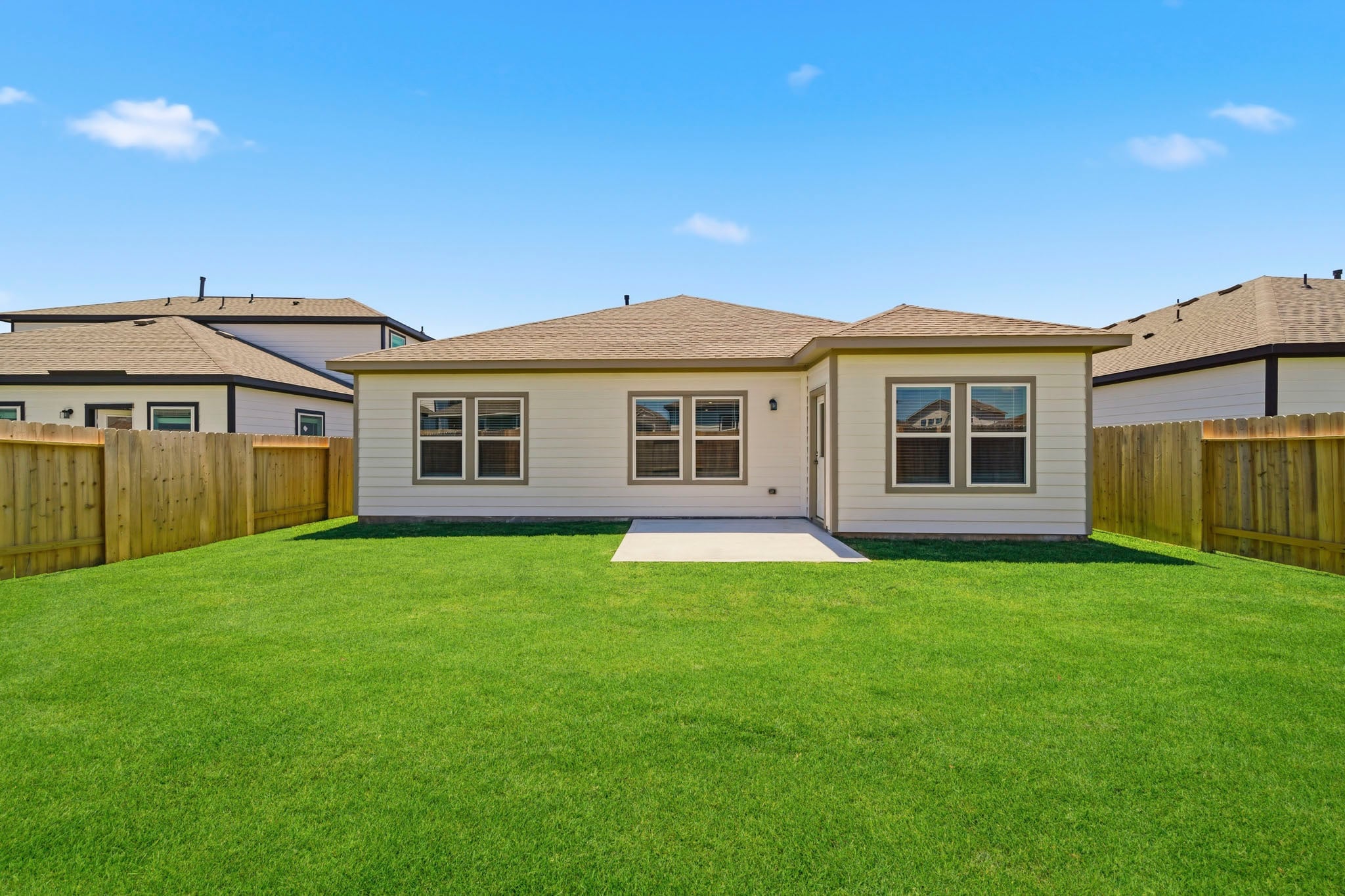 A house with a green lawn.