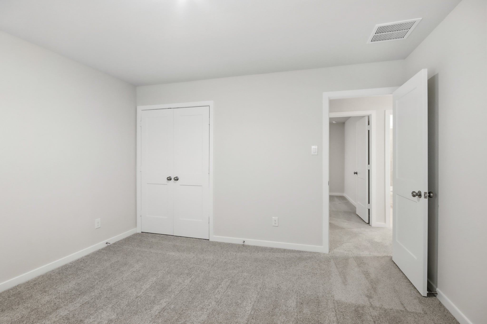 A room with white doors.