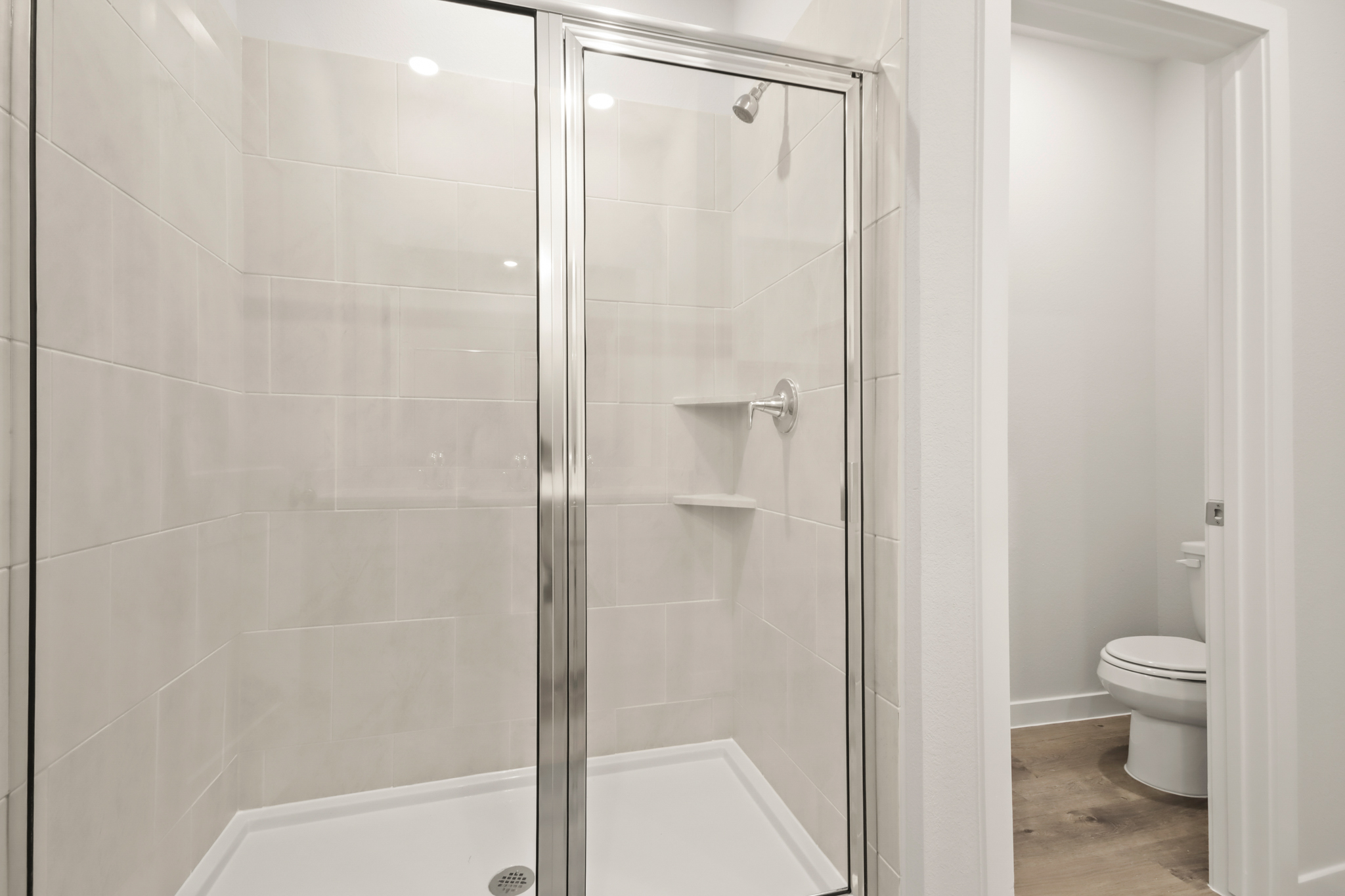 A bathroom with a glass shower.
