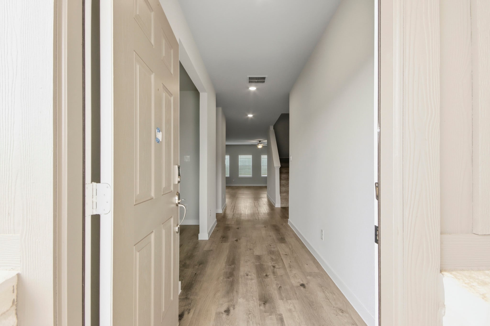 A hallway with white doors.