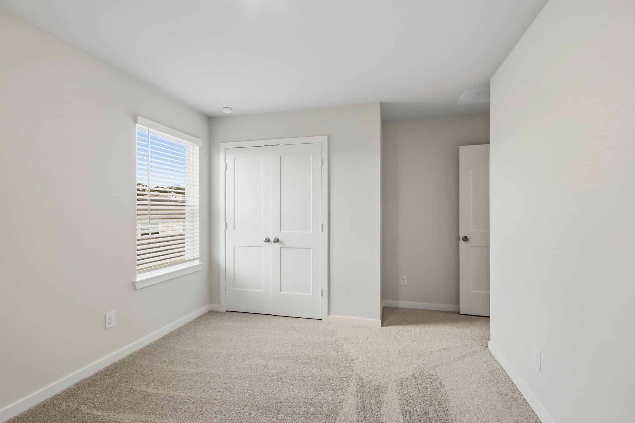A room with white doors.