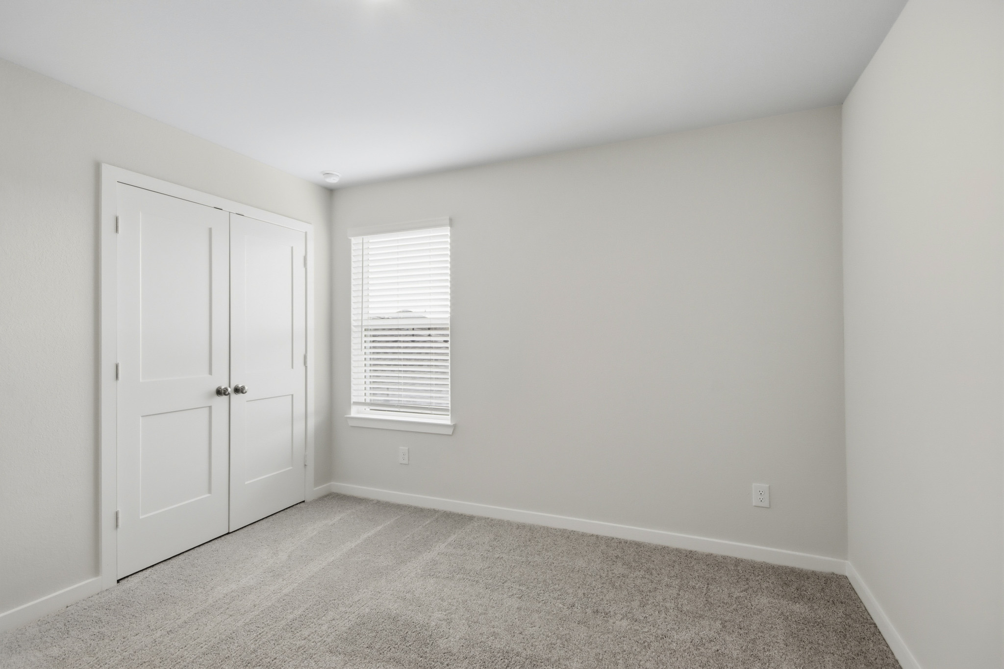 A room with white doors.