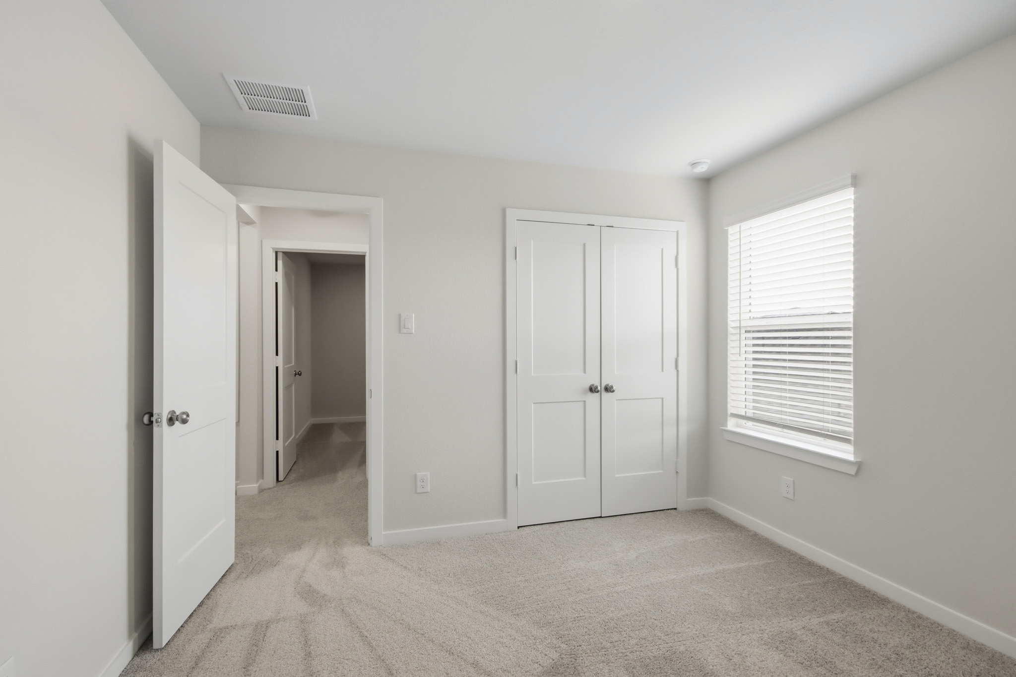 A room with white doors.