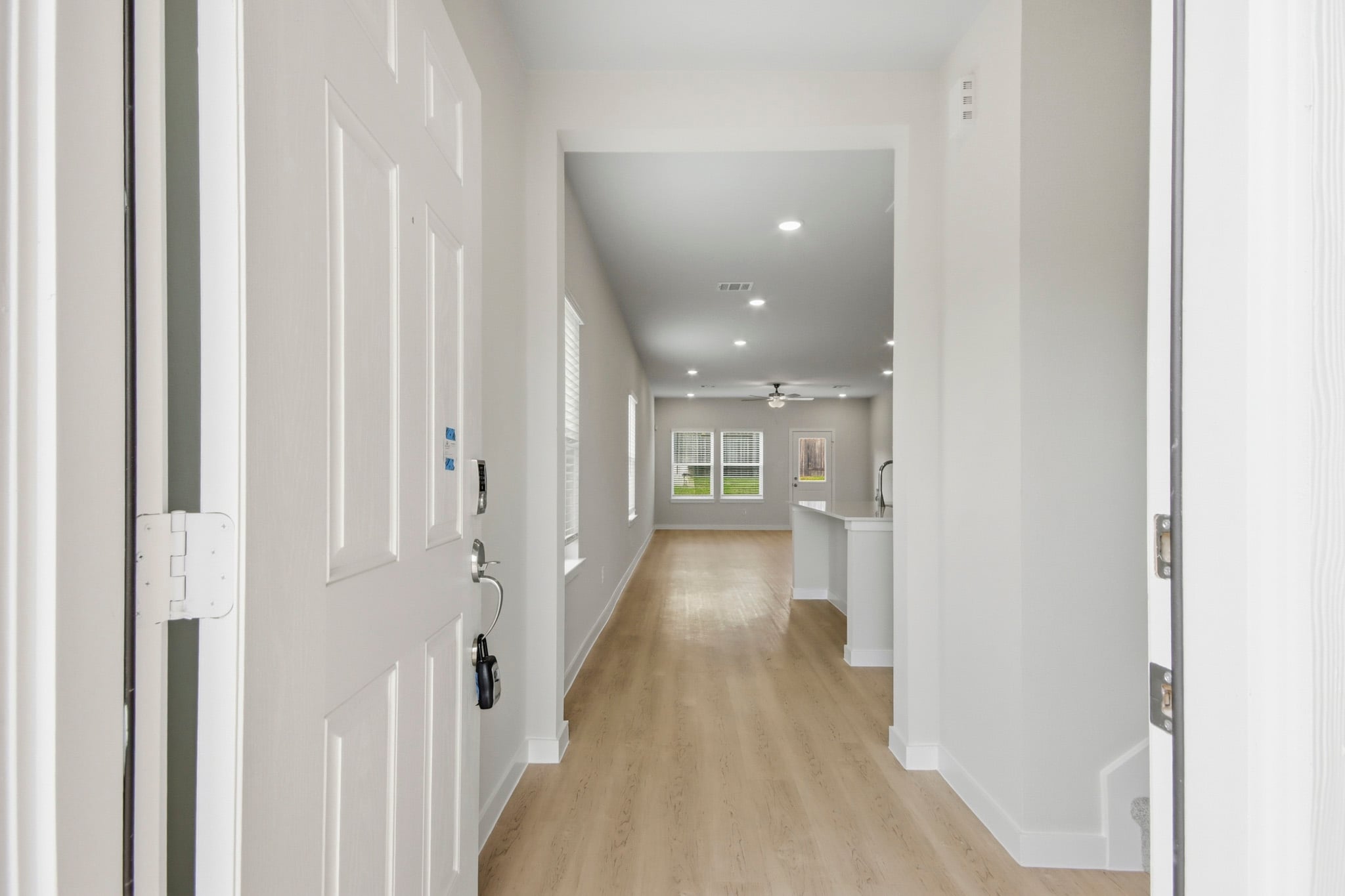 A hallway with white doors.