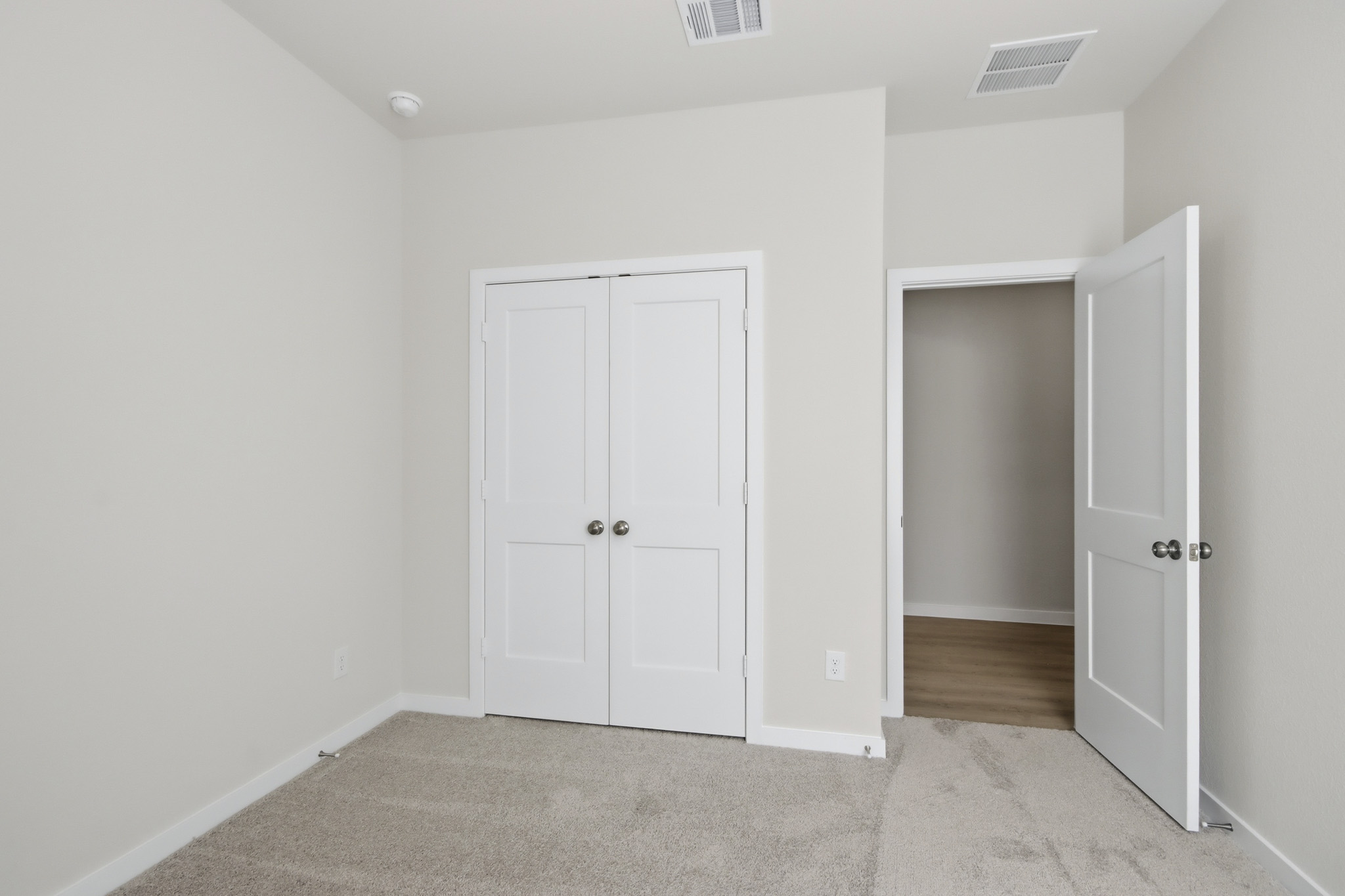 A room with white doors.