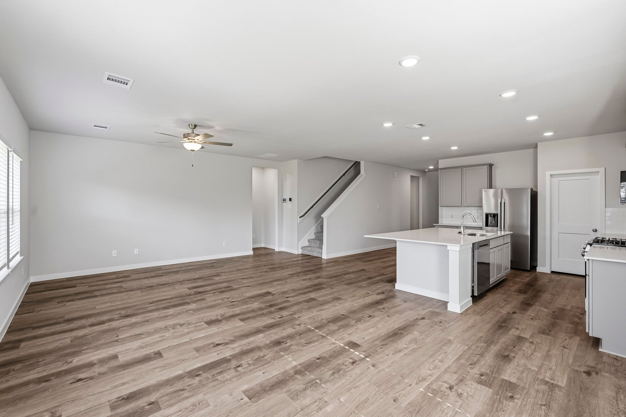 A large kitchen with white cabinets.