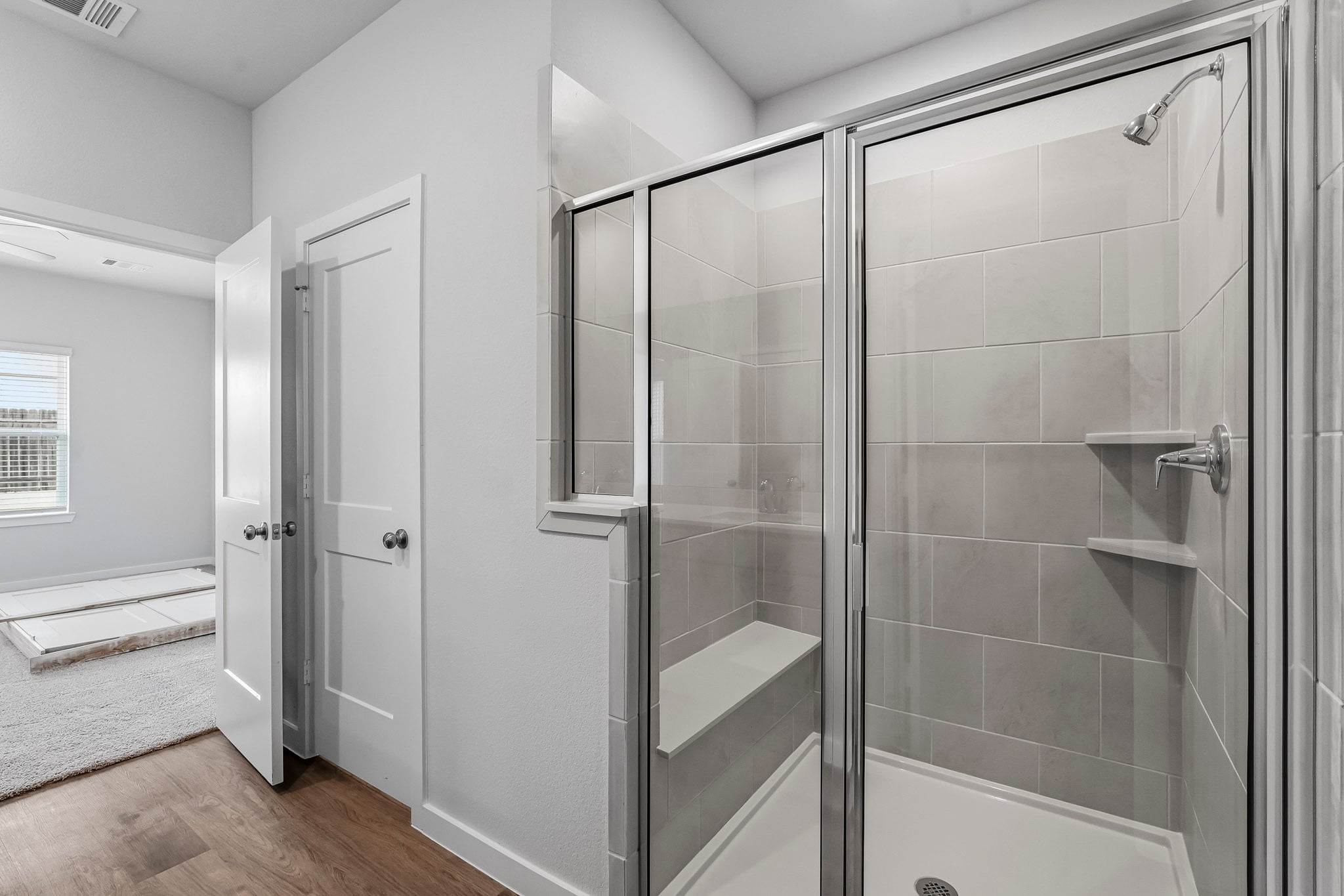 A bathroom with a glass shower.