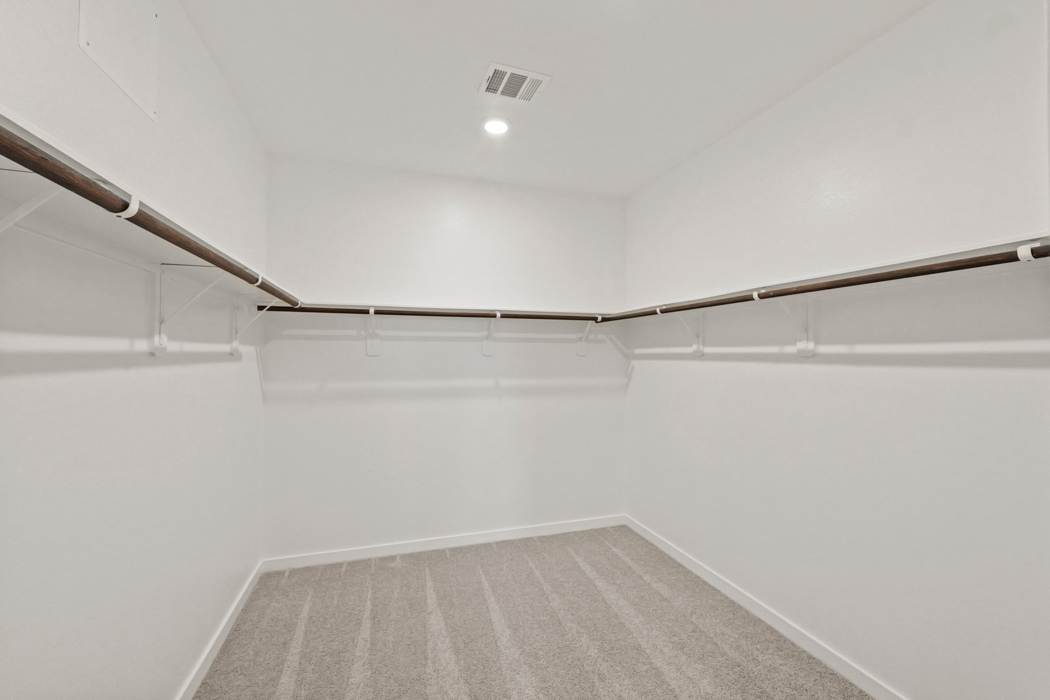 A white room with a staircase.