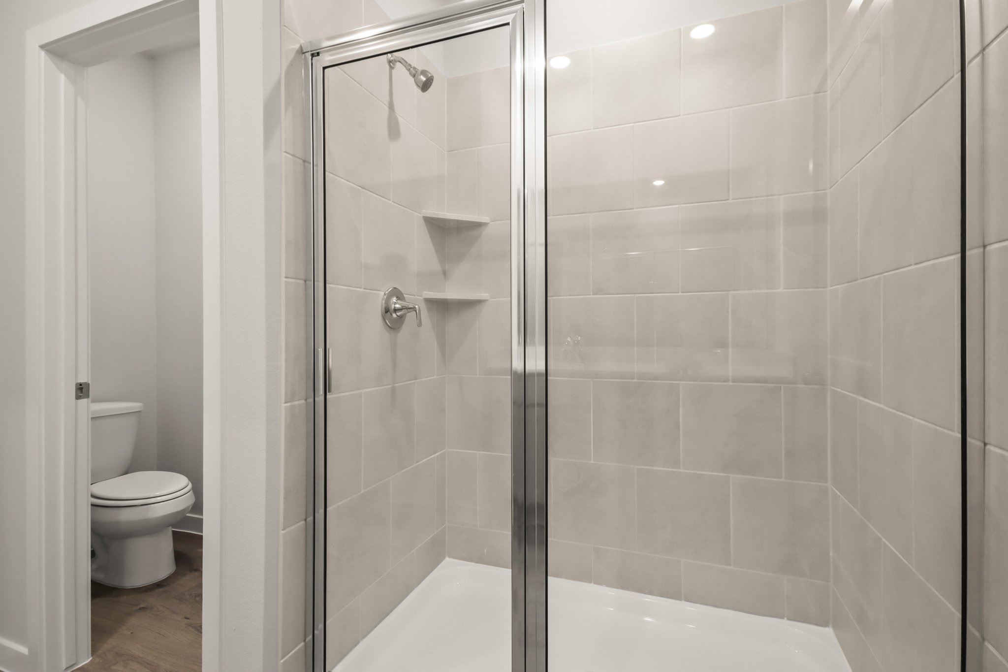 A bathroom with a glass shower.