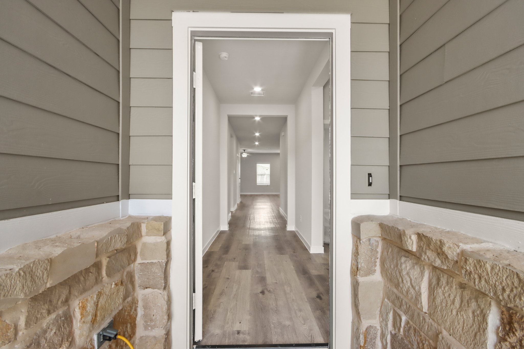 A hallway with brick walls.