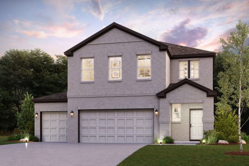 A grey house with a garage.