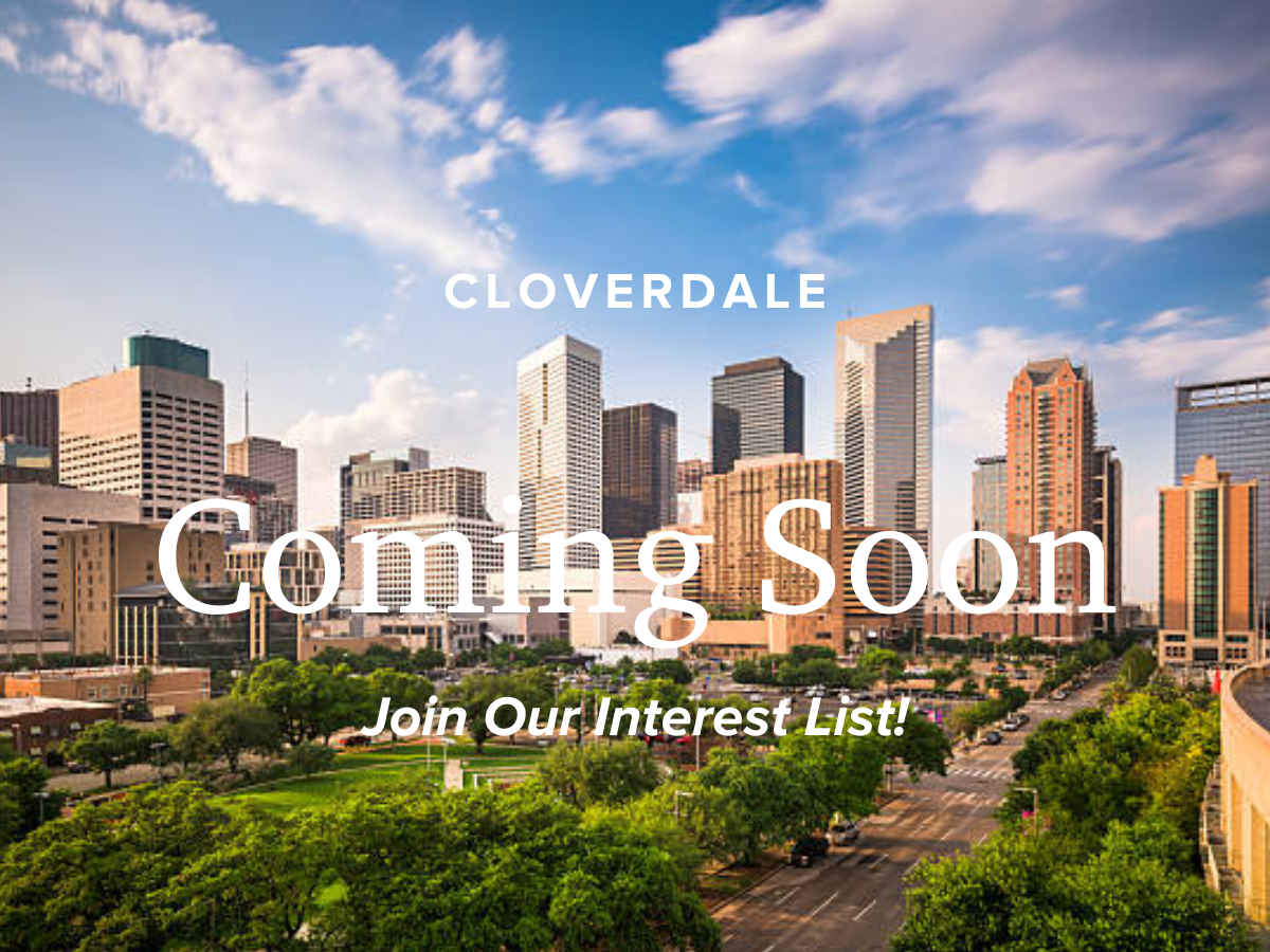 A city skyline with trees and buildings.