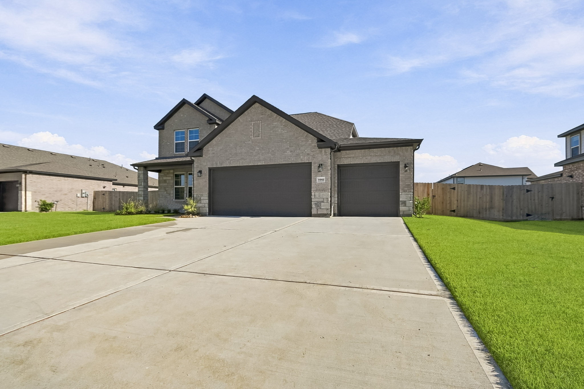 A driveway leading to a house.