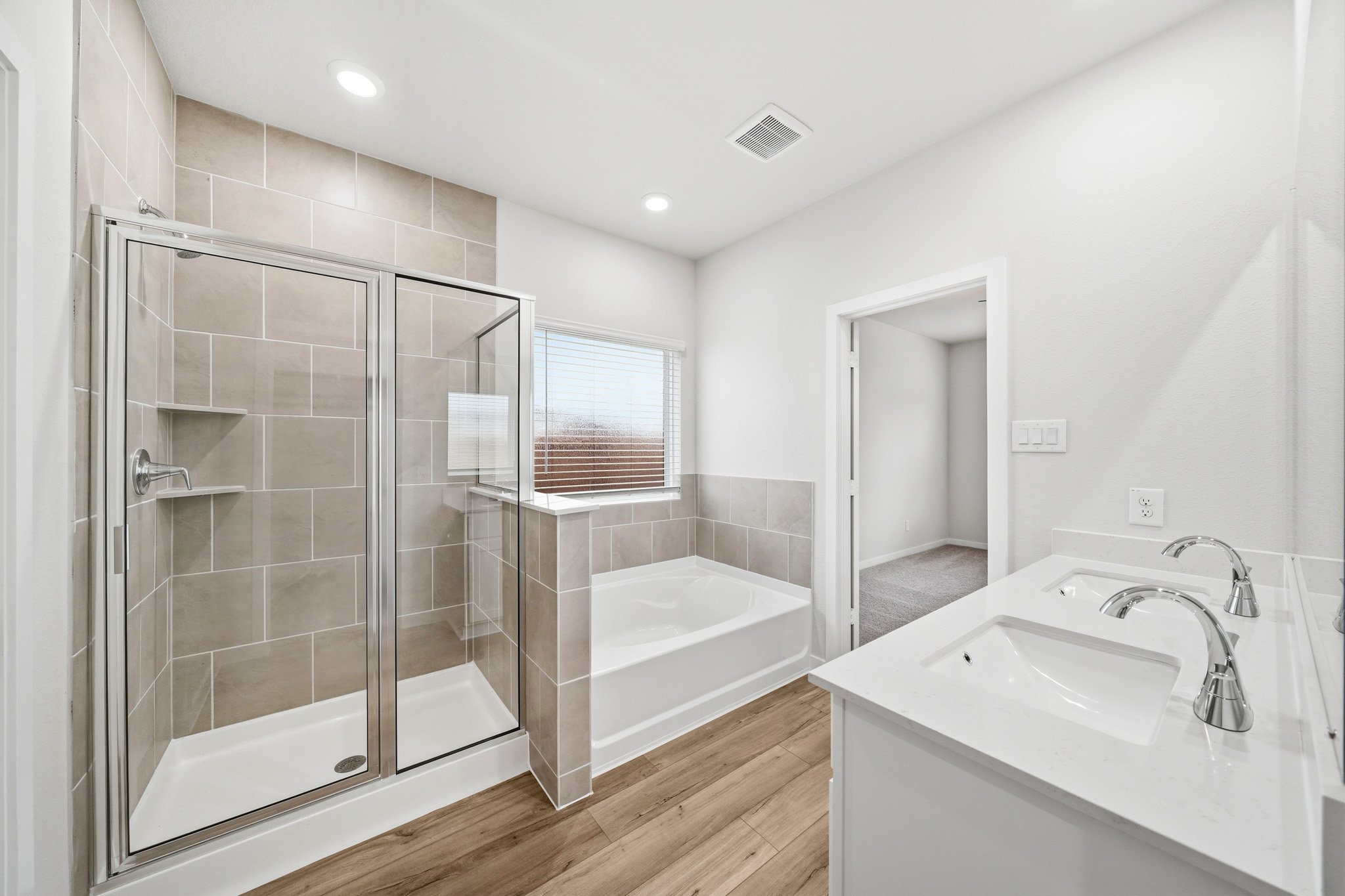 A bathroom with a glass shower.