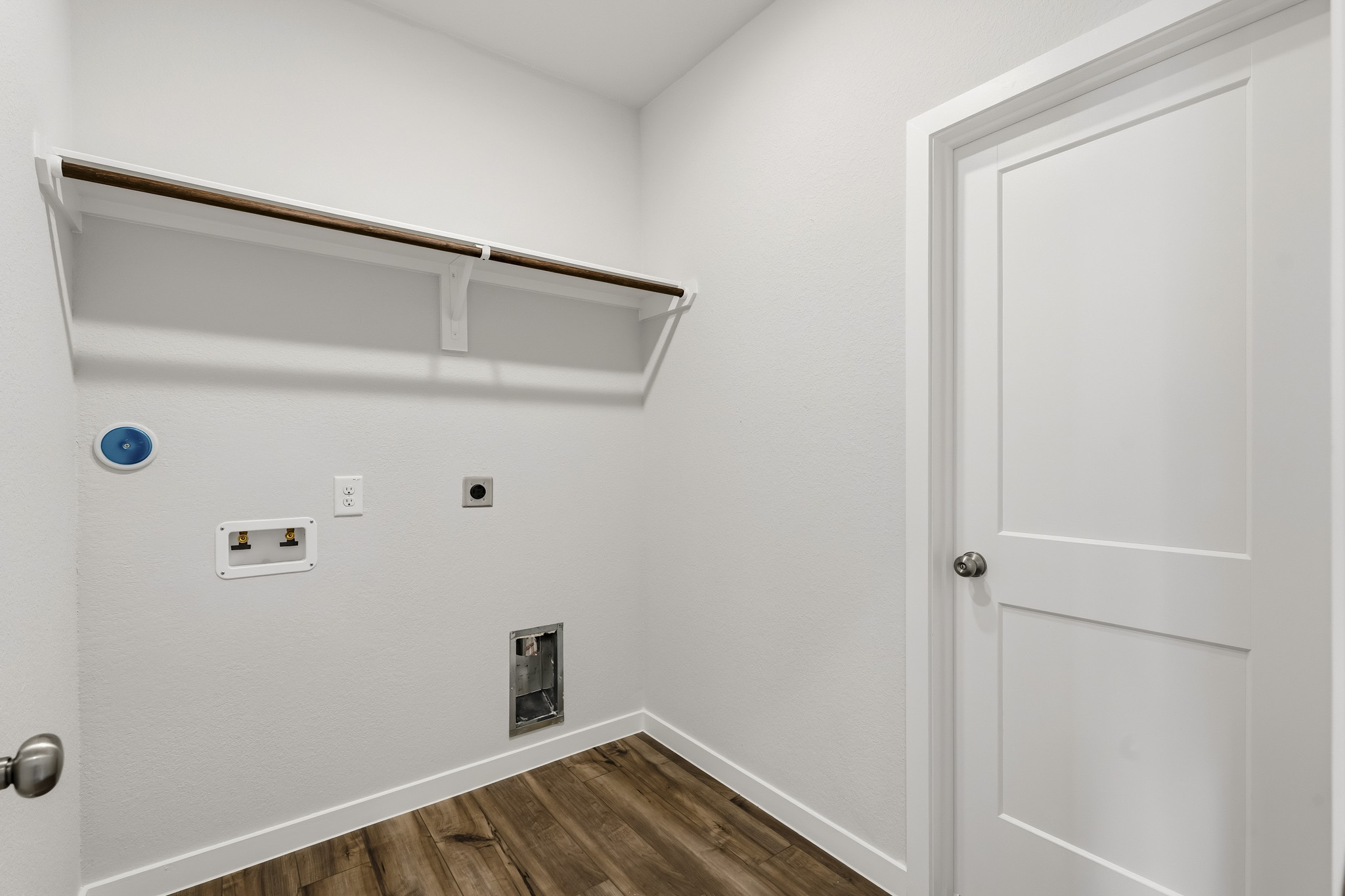 A white door with a blue ball.