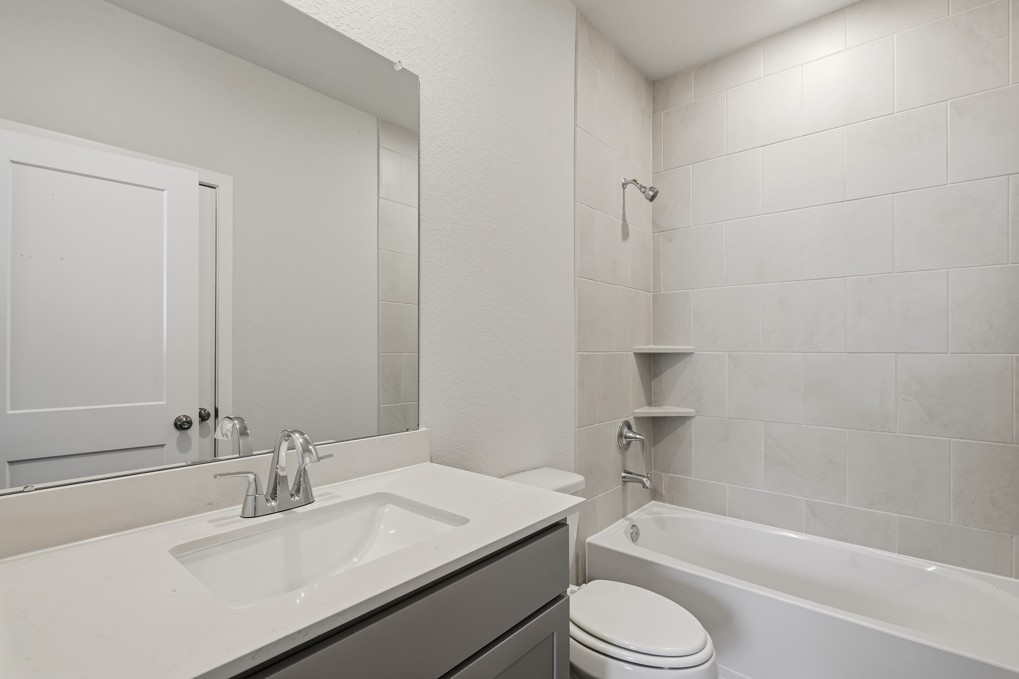 A bathroom with a sink and toilet.
