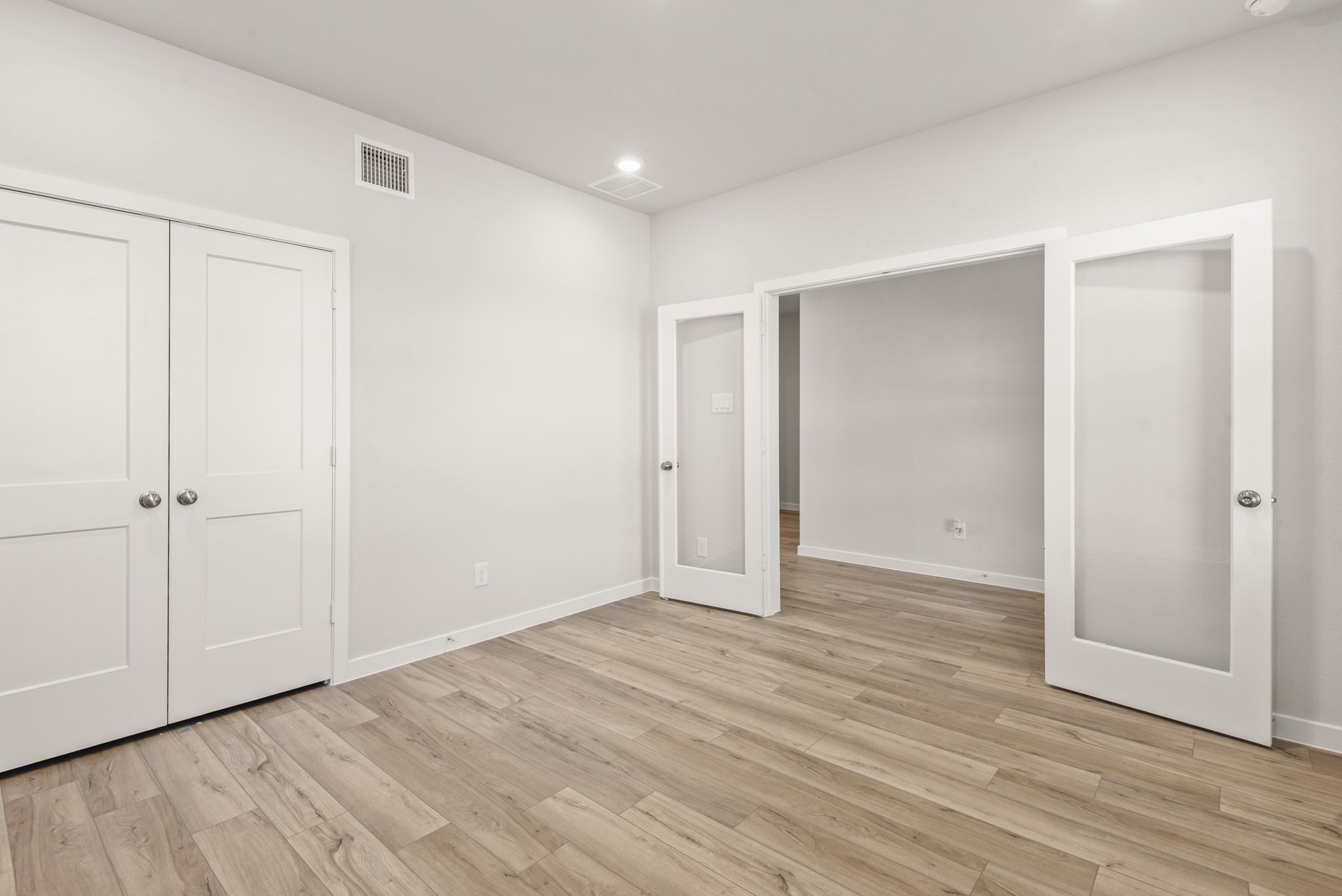 A room with white doors.