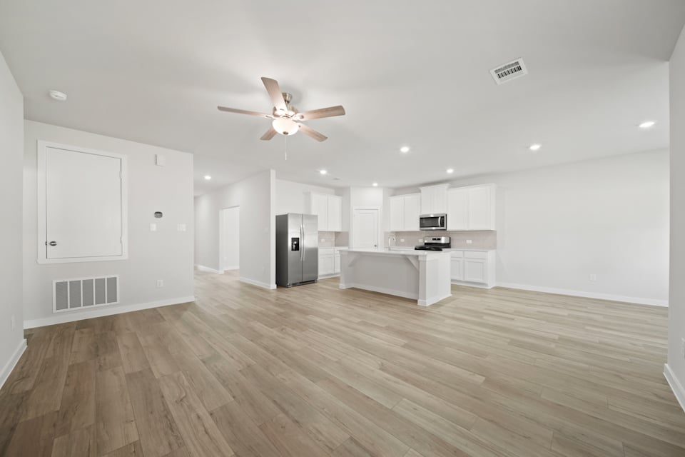 A large kitchen with white cabinets.