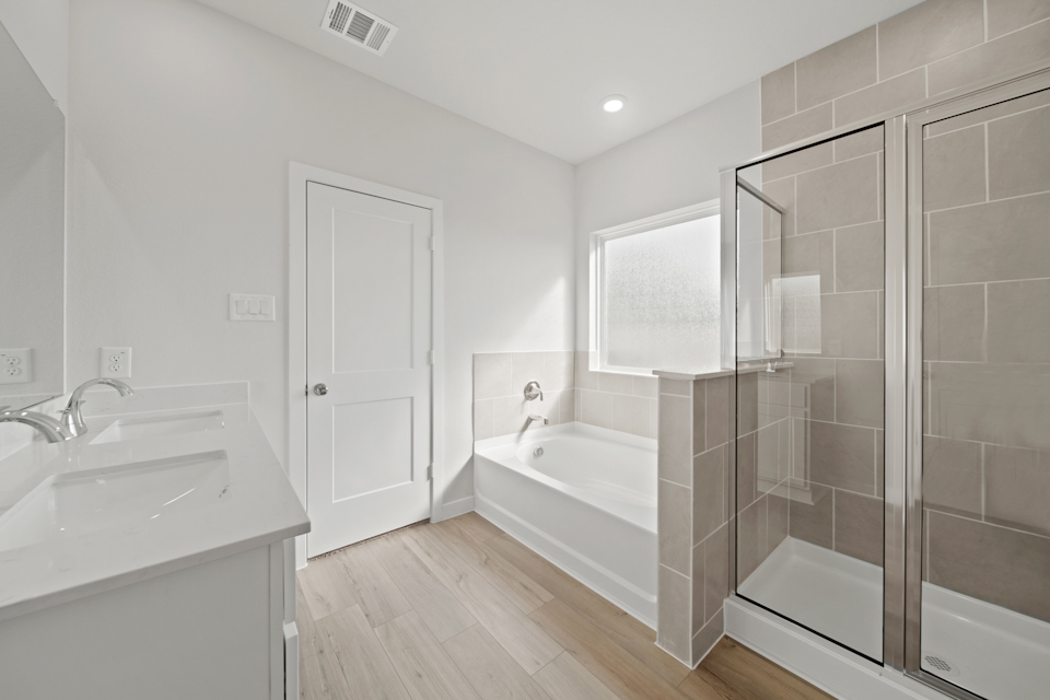 A bathroom with a glass shower.