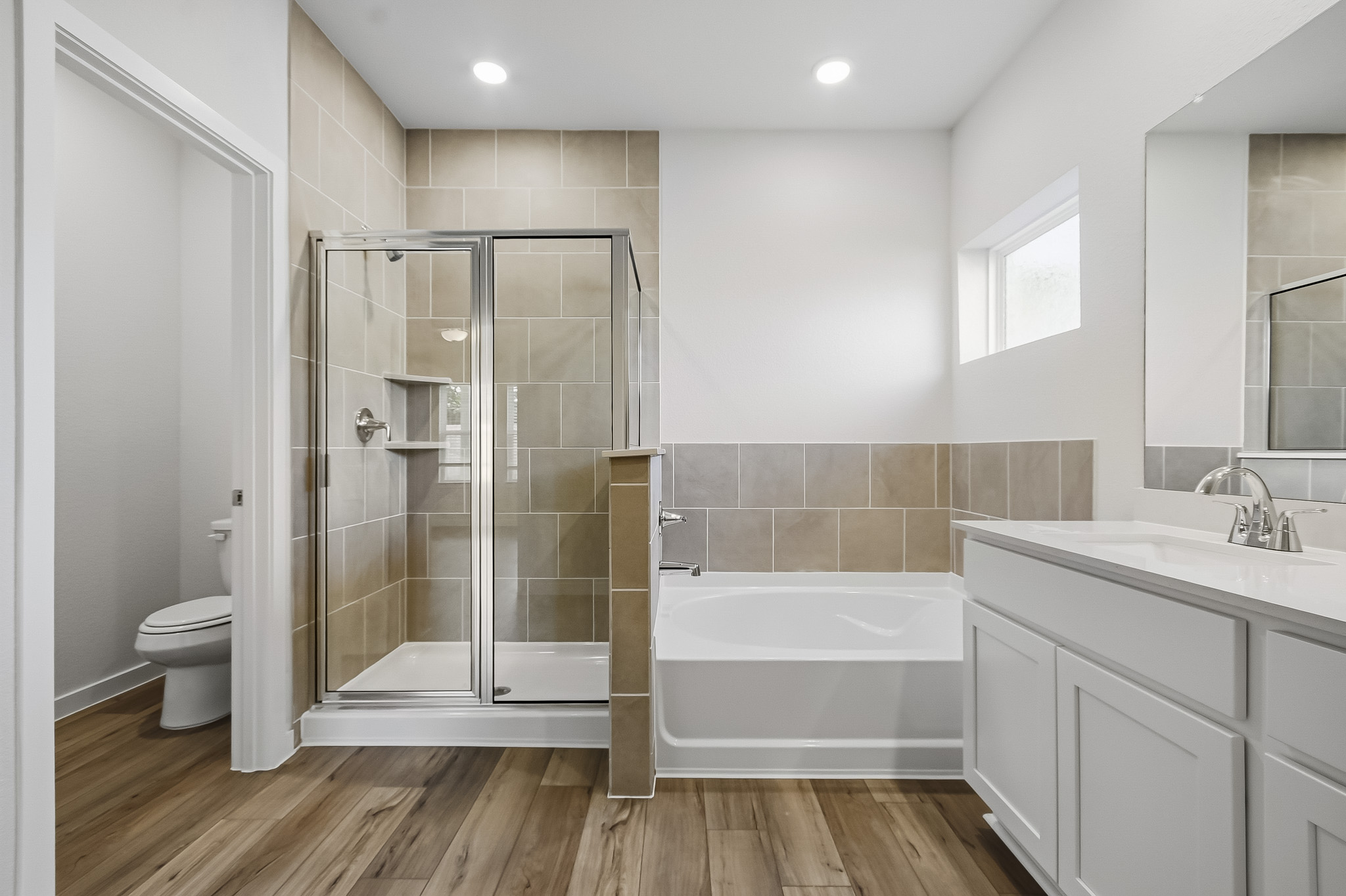 A bathroom with a glass shower.