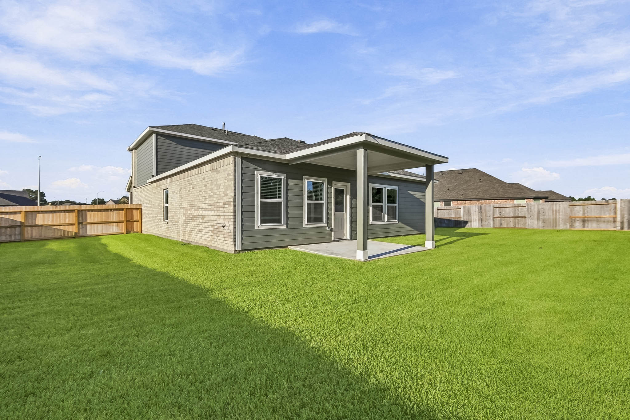 A house with a grass yard.