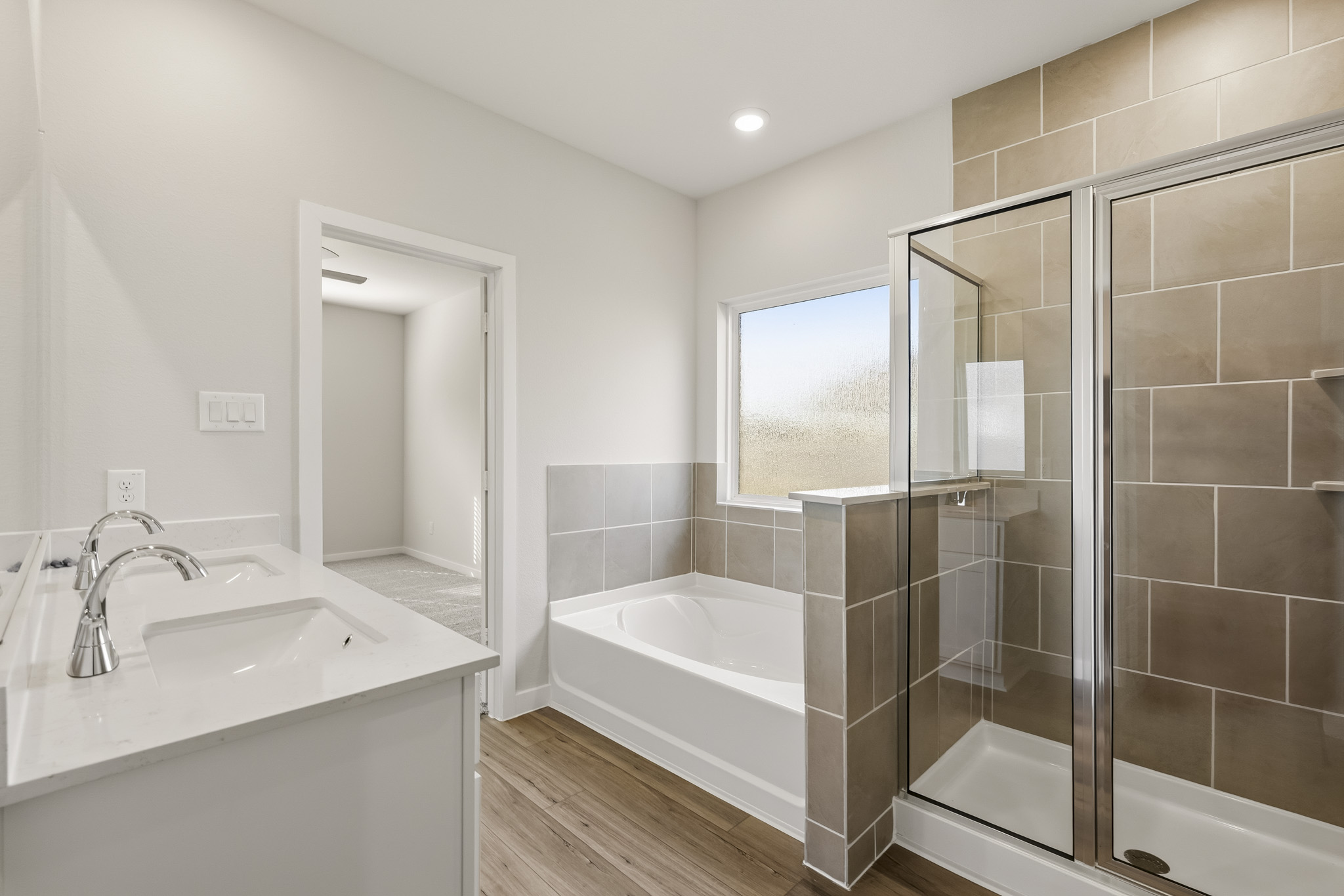 A bathroom with a tub and sink.