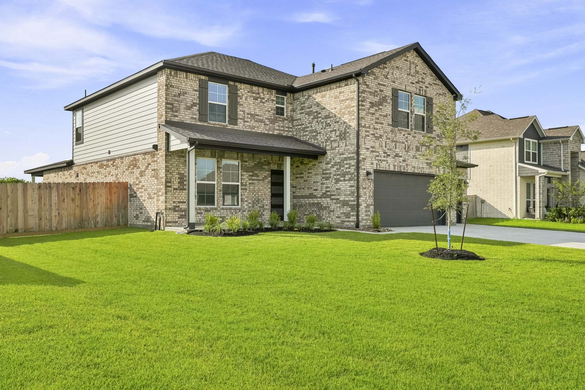A large house with a lawn.