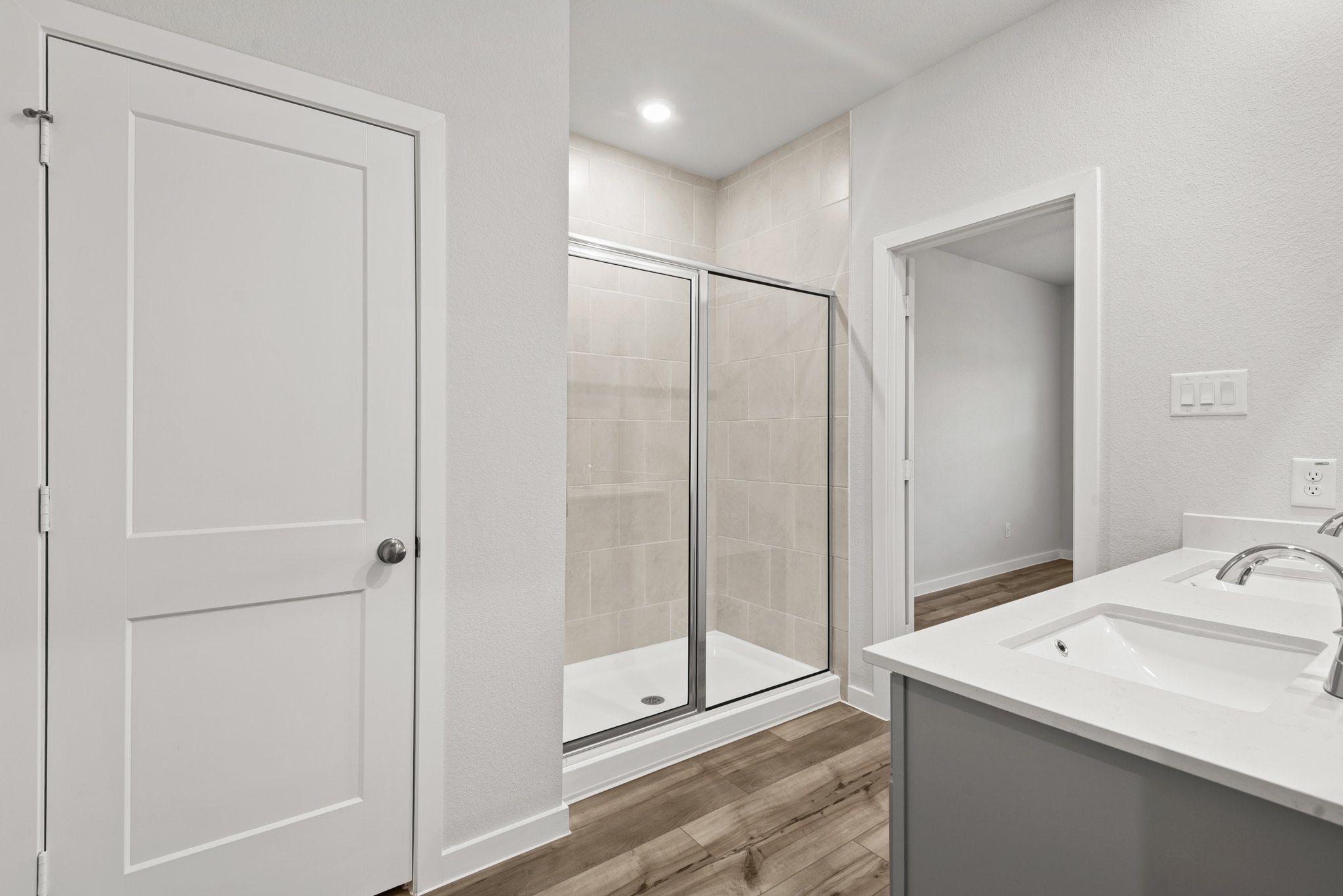 A bathroom with a glass shower.