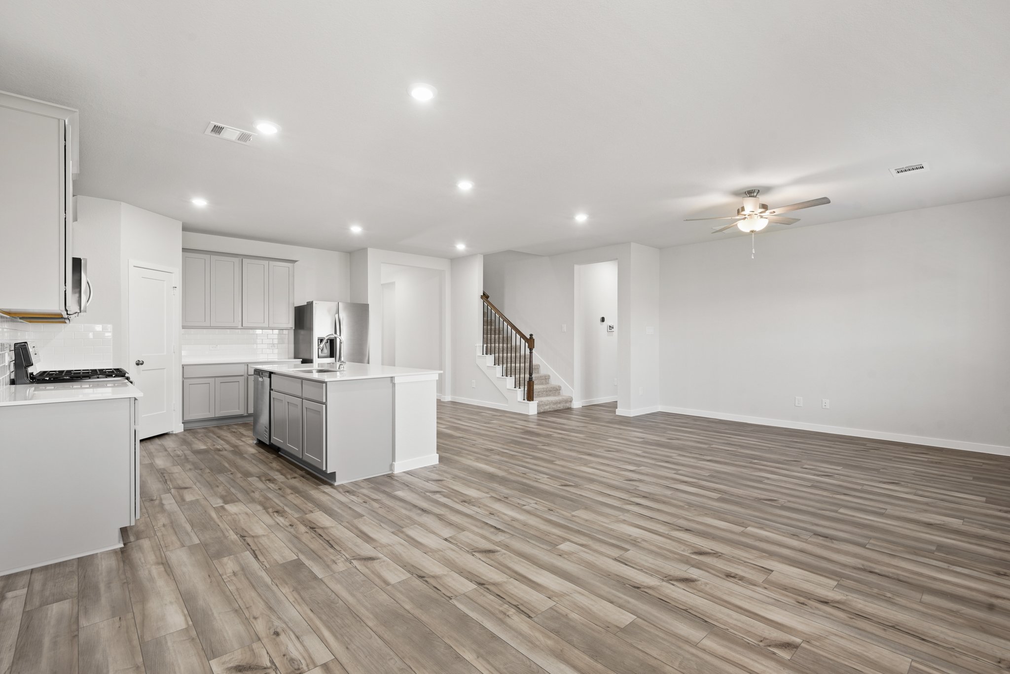 A large kitchen with white cabinets.