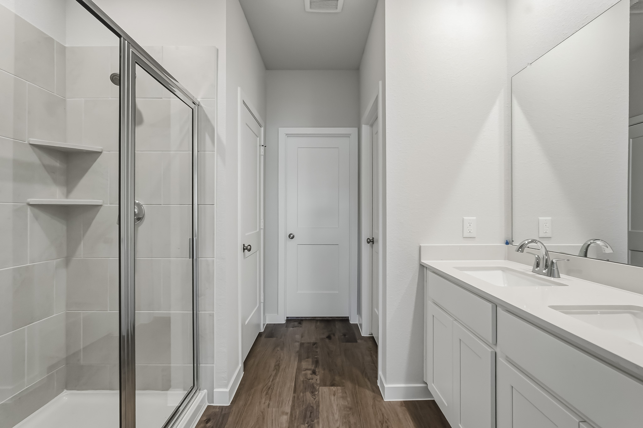 A bathroom with a glass shower.