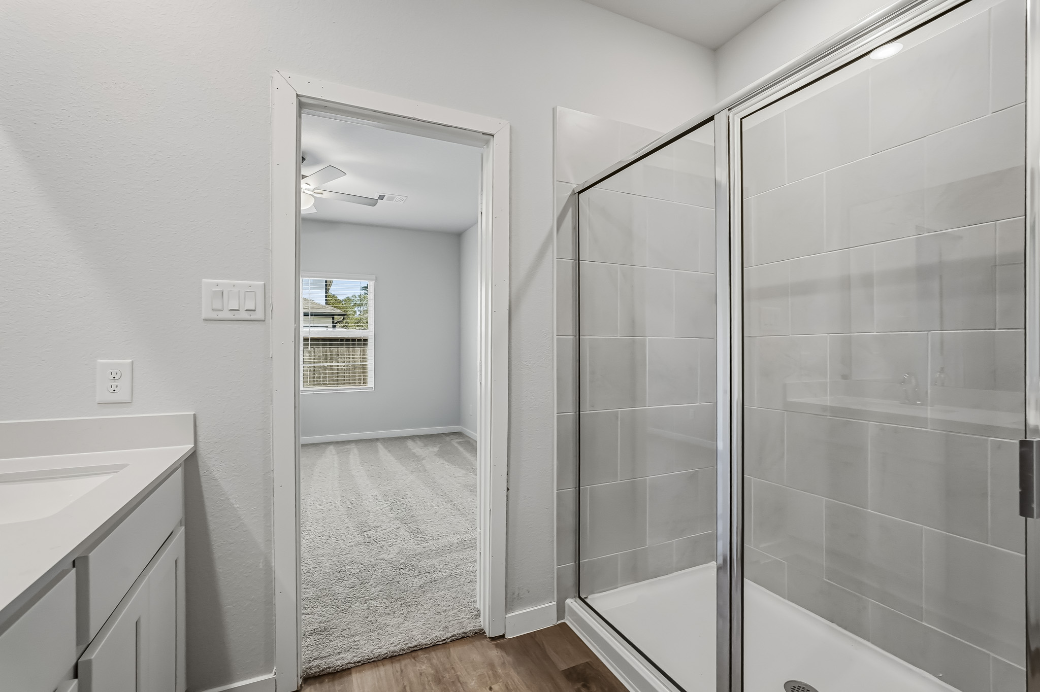 A bathroom with a glass shower.