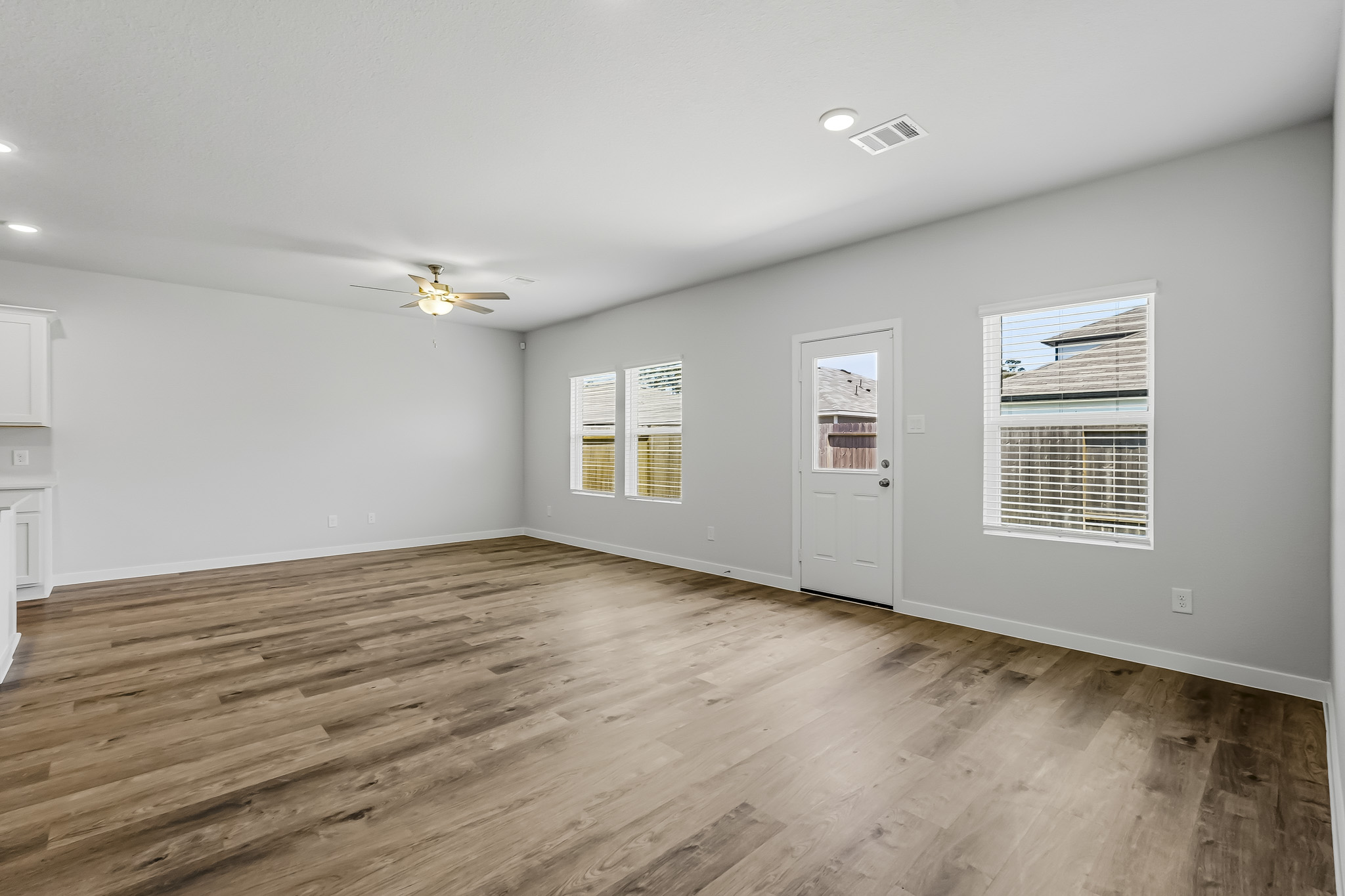 A room with a wood floor and a wood floor.