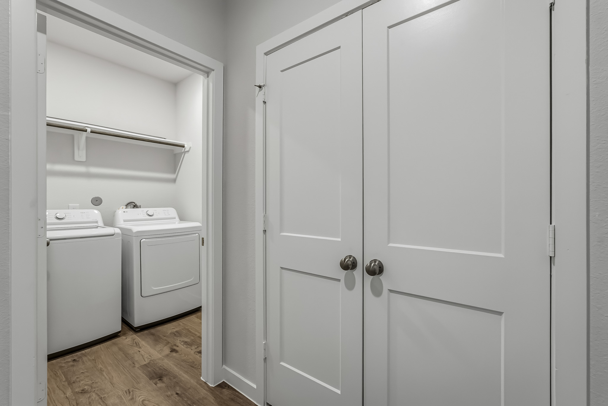 A white door next to a white door.